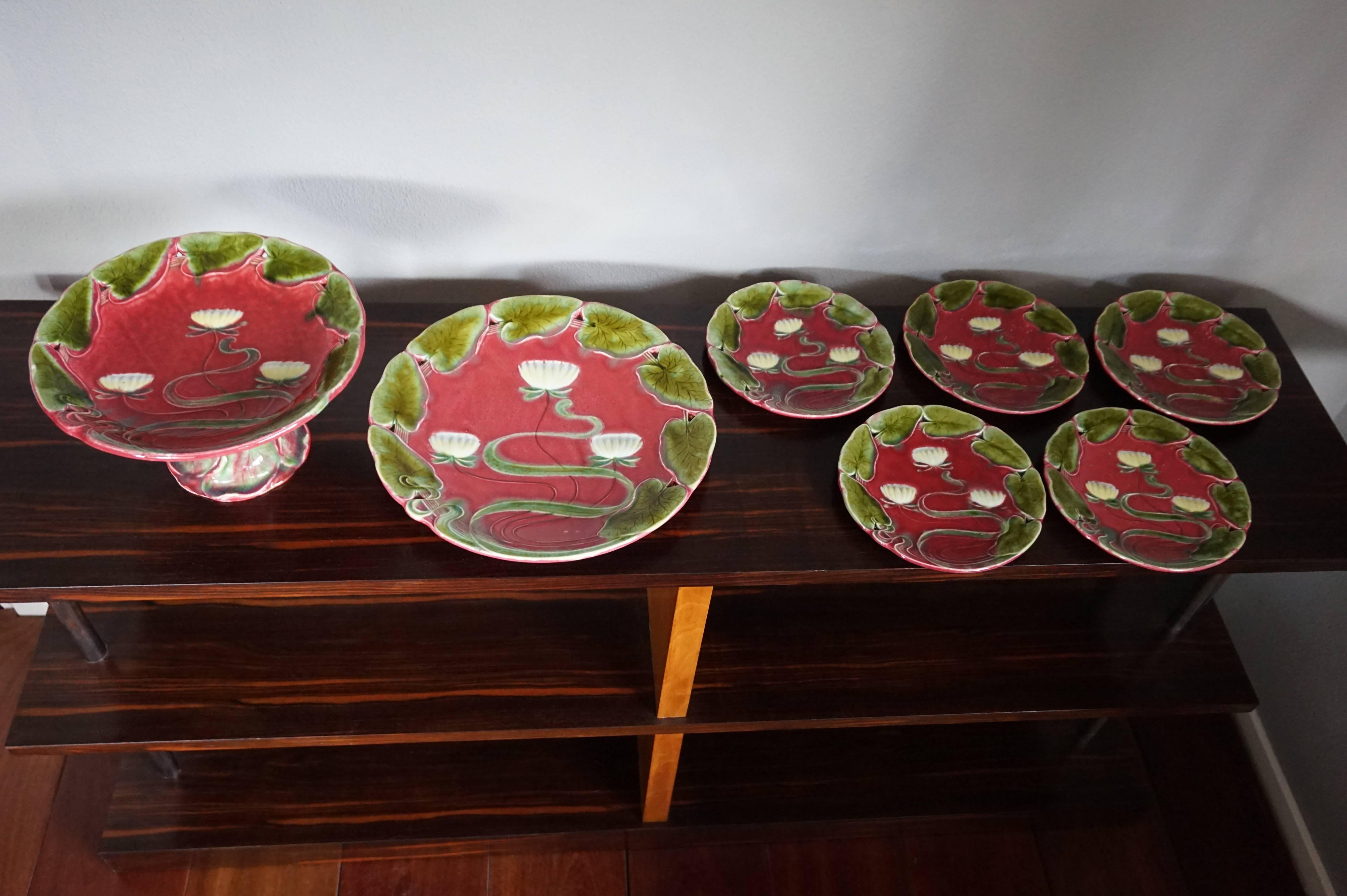 Rare and impressive Art Nouveau tableware for serving cake and fruit.

We cannot think of a better way to present a cake or a pie than on this stunning Art Nouveau tableware. These artistically designed and beautifully colored and glazed plates are