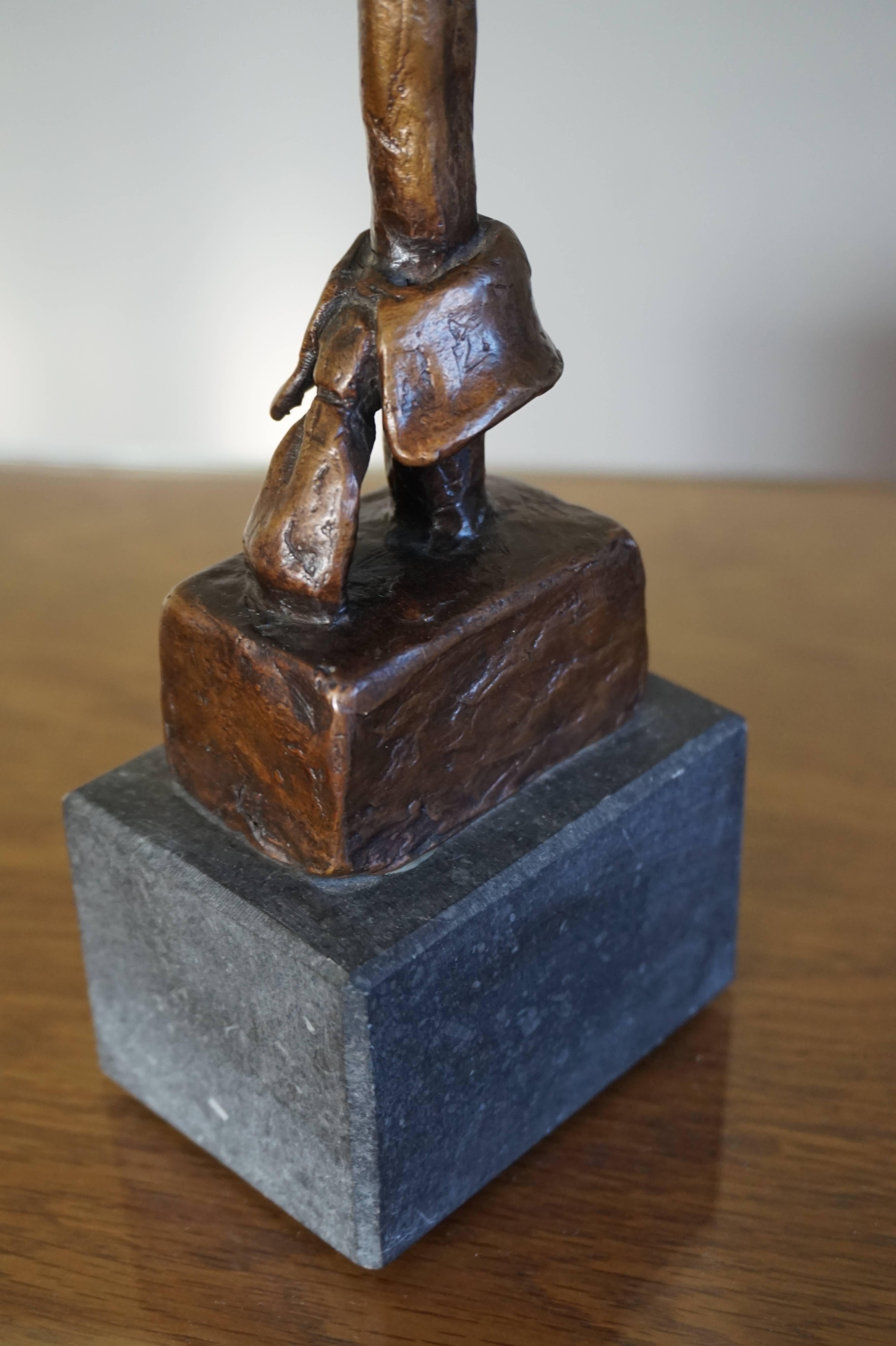 Artistic bronze for Fashionados, sharp dressed men and/or dandies.

If there is such a thing as a competition for the best dressed male then this artistically designed and handcrafted, modern bronze sculpture would make the perfect trophy for the