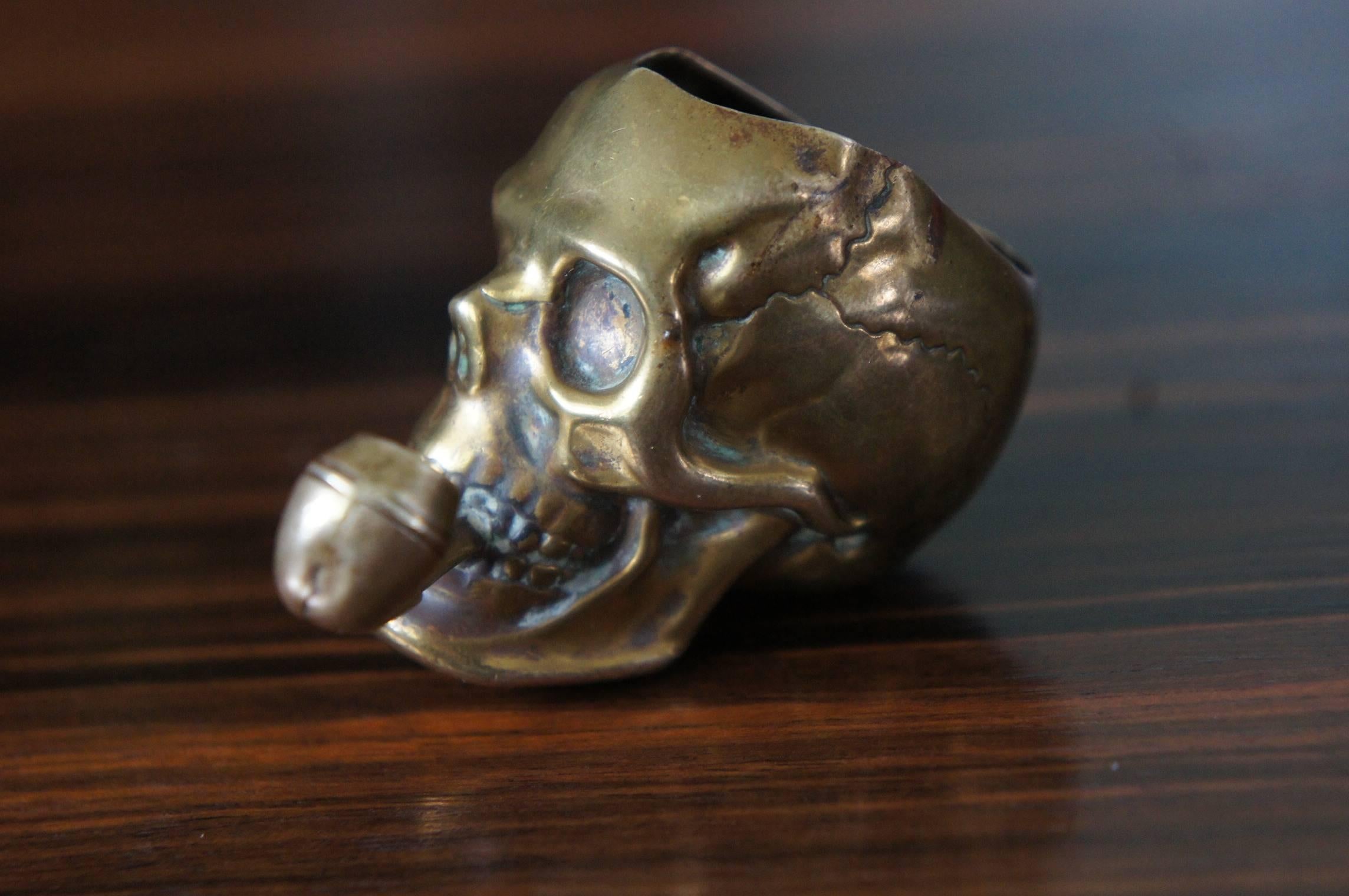 Unique smoking and death related desk piece from the late 1800s.

This antique, pipe smoking skull makes a great display piece. It may be small in size, but that is almost always the case with antique vesta cases. This fine and possibly unique