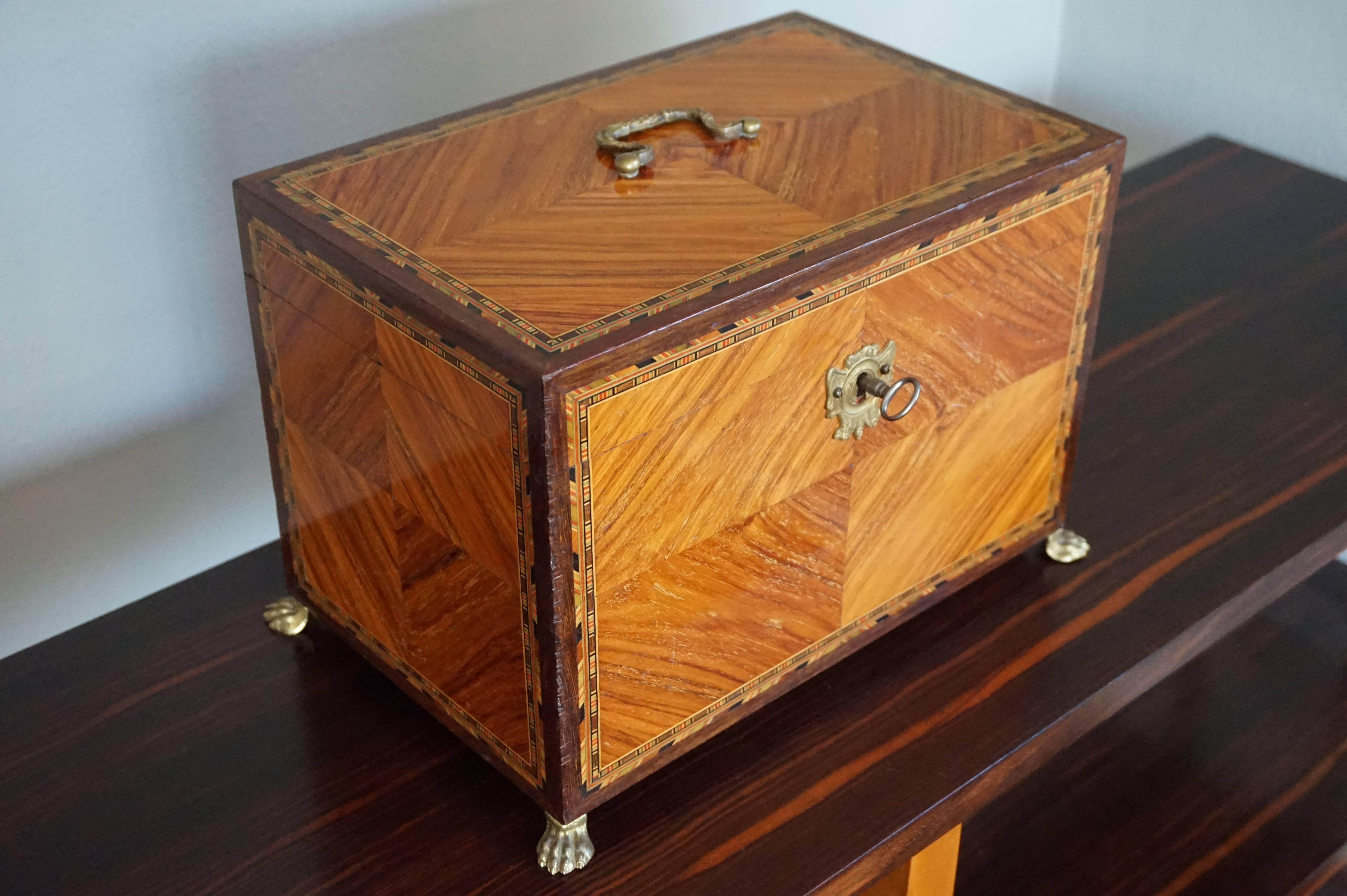Good size and all handcrafted, late 19th century box.

The color and grain of this kingwood box is amazing and what makes it extra rare, is the fact that the inlaid marquetry around the edges still has the original yellow, green and red colors.