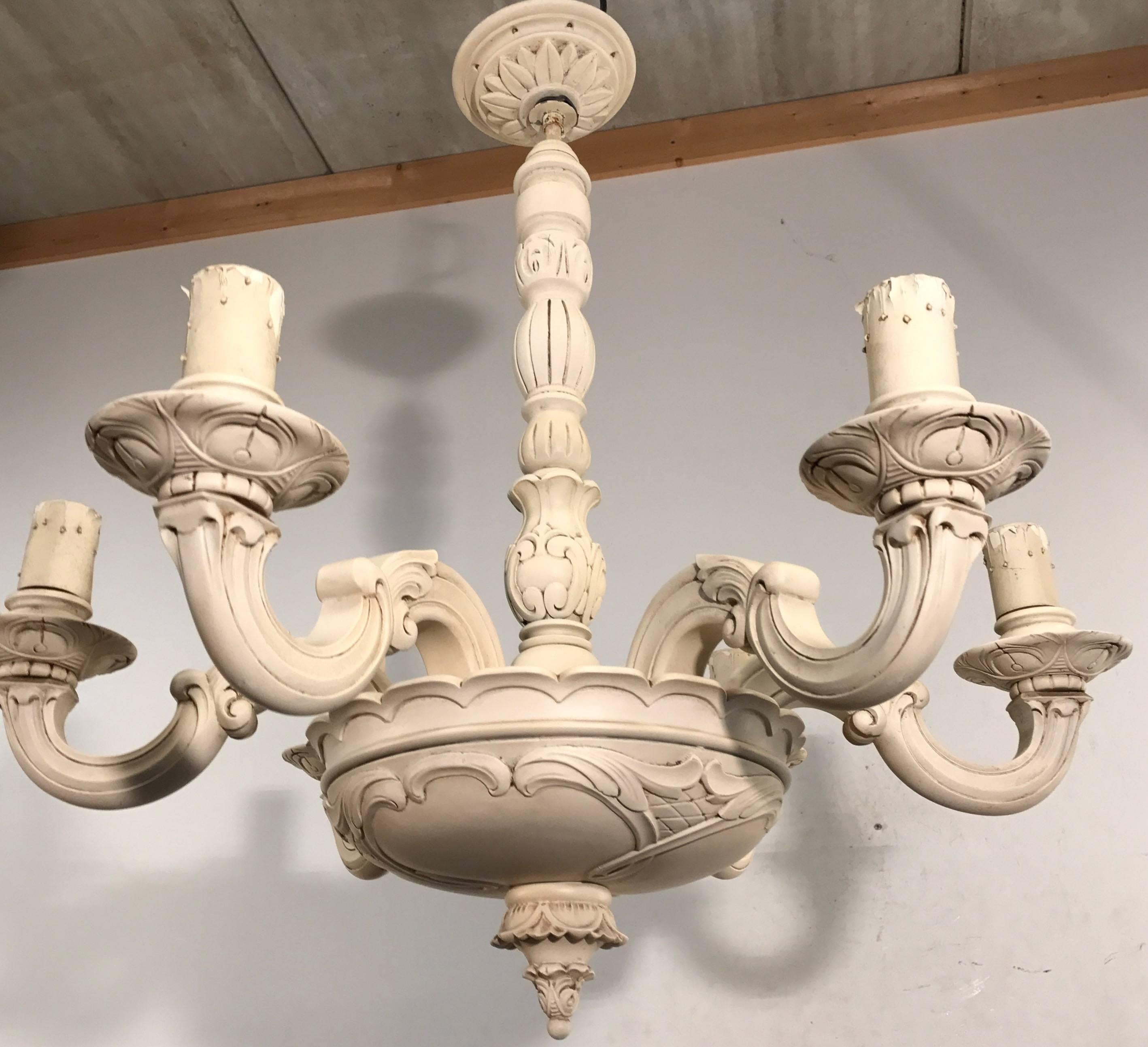 Stylish and all handcrafted chandelier from the turn of the century. 

This good quality pendant of a 100 years old has six perfectly and evenly hand-carved arms. This stylish example of turn of the century workmanship is made of solid, nutwood wood