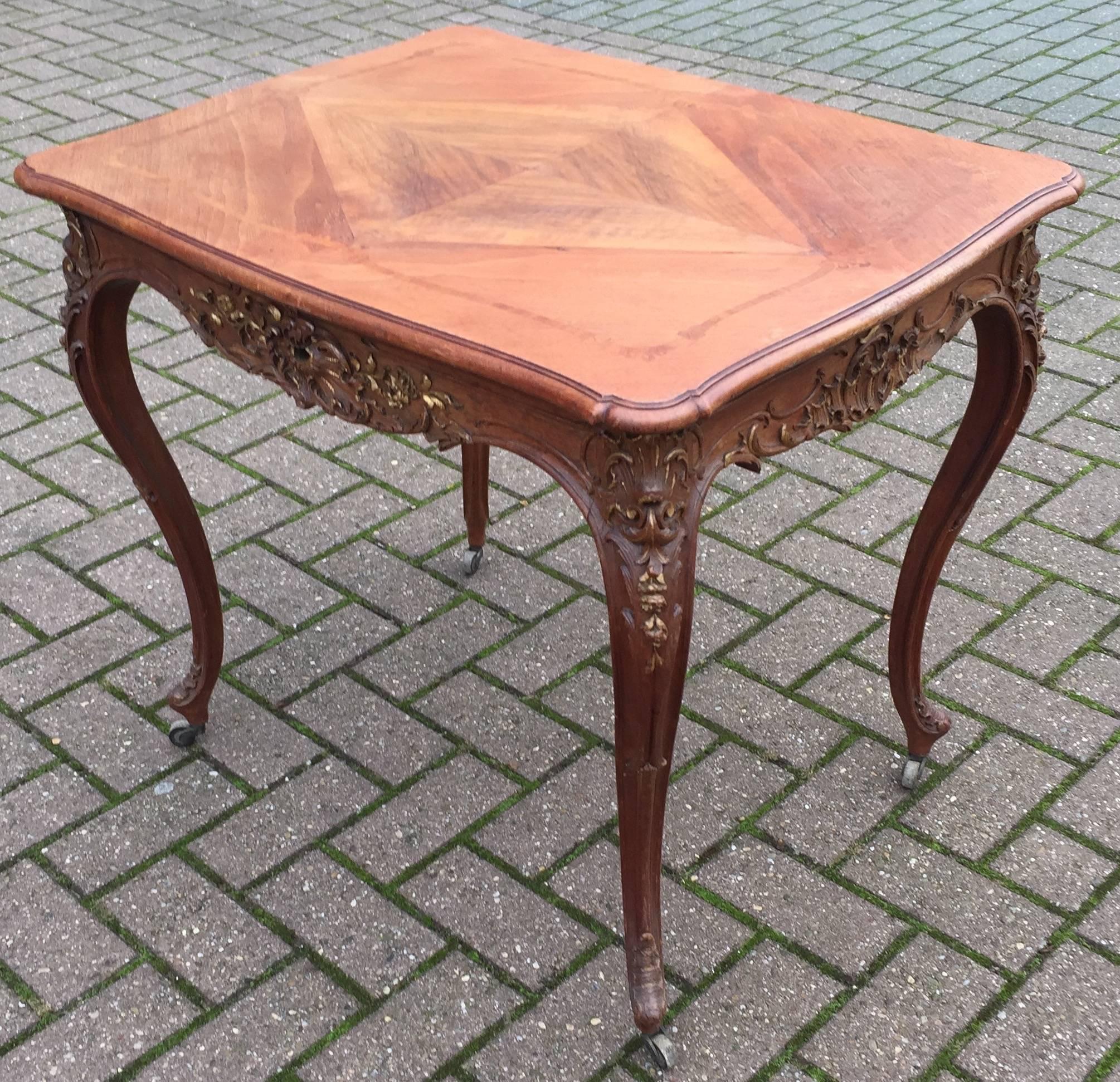 Elegant design and top quality carved multi purpose antique table.

The top of this beautifully designed and very well executed table is inlaid with a diamond in the center which grows into a larger, but more organic diamond as it moves outward. The