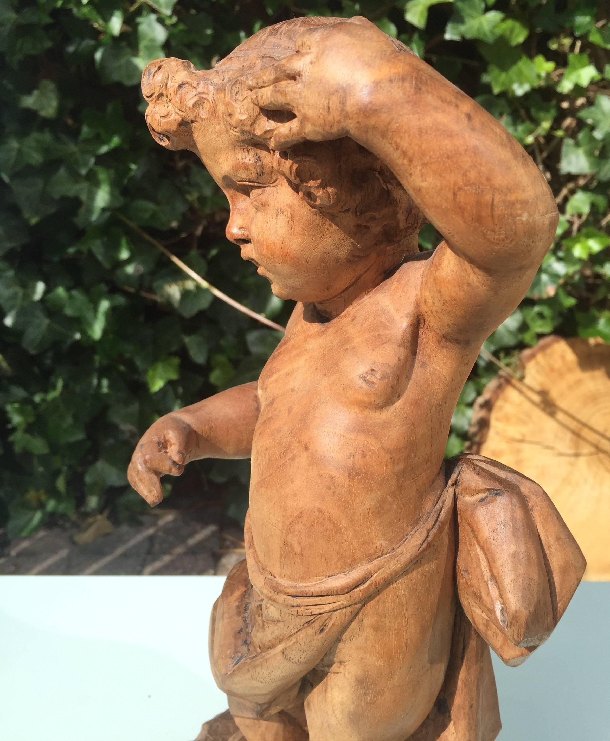 Early 19th Century French Hand-Carved Nutwood Putto Boy Sculpture For Sale 1