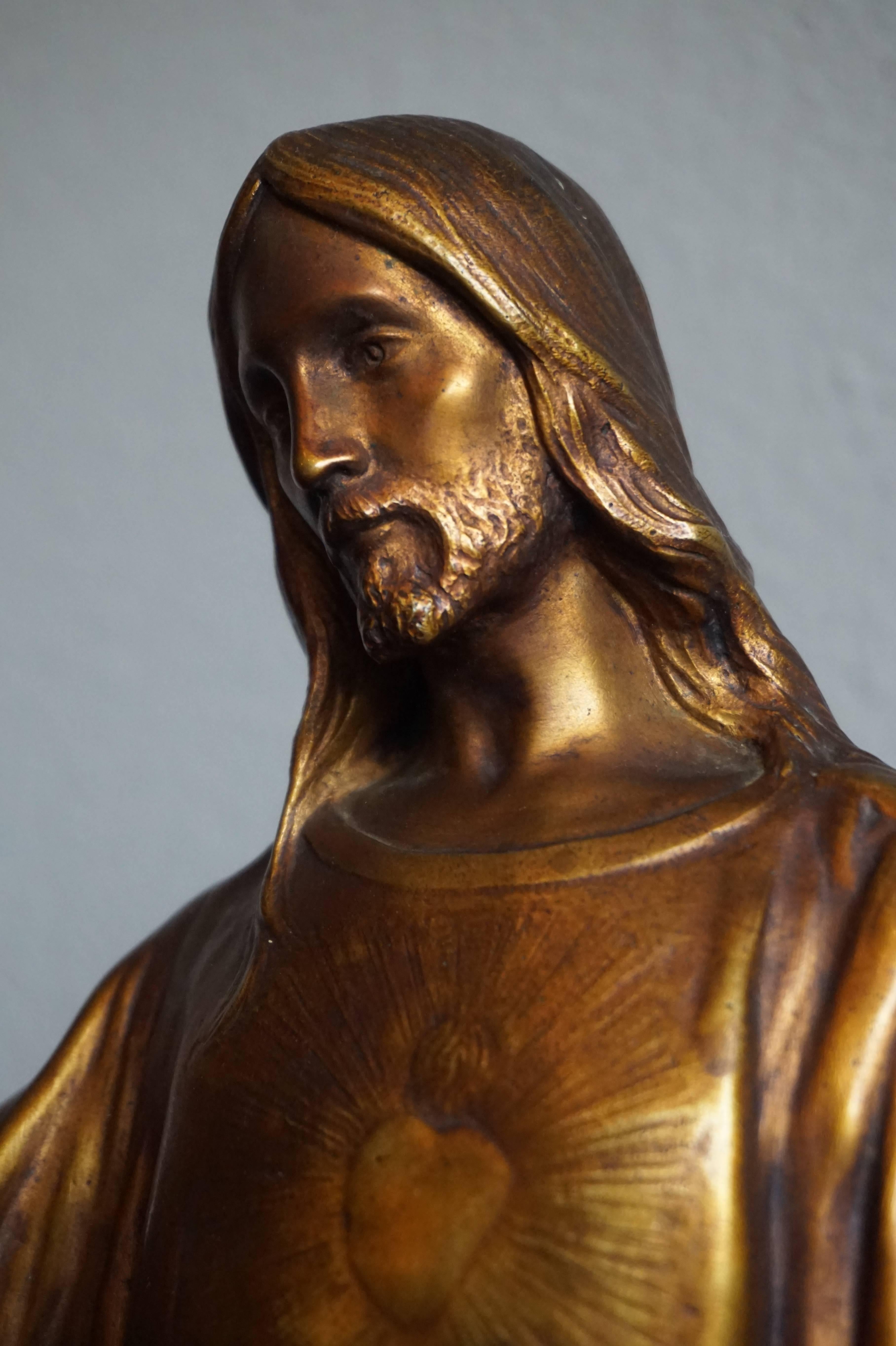 Stunning and large work of religious art.

The fine details and the perfectly natural poisture of this amazing Christ sculpture reveal the work of a master sculptor. This bronze 'statuette' of the sacred heart of Jesus is both gilt and patinated and
