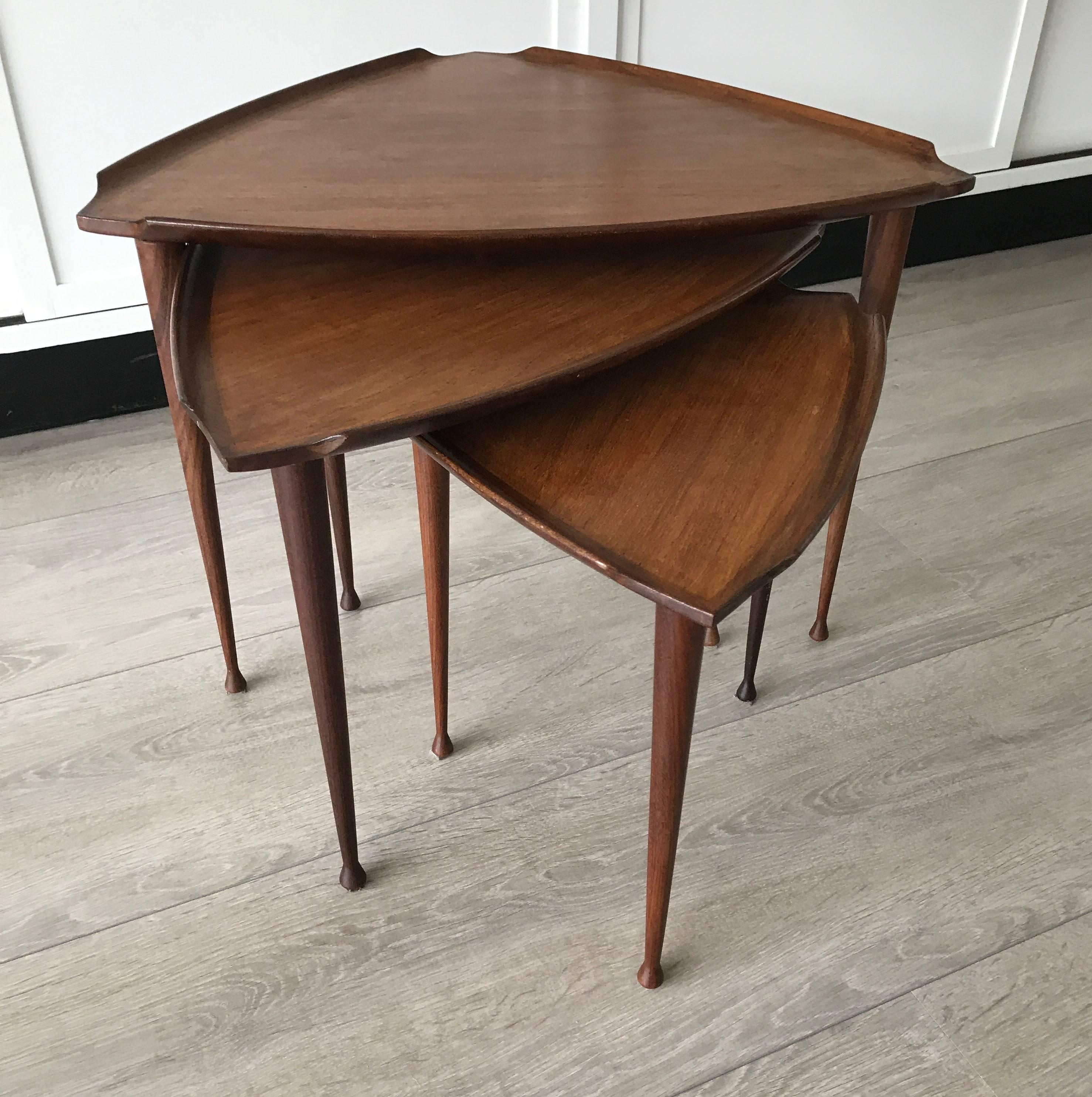 Good quality and great Scandinavian design nest of tables.

This, 1960s Danish nest of tables is of beautiful quality and design. The combination of the light colors, the surfboard shaped edges and the elegant legs make this set an absolute joy to