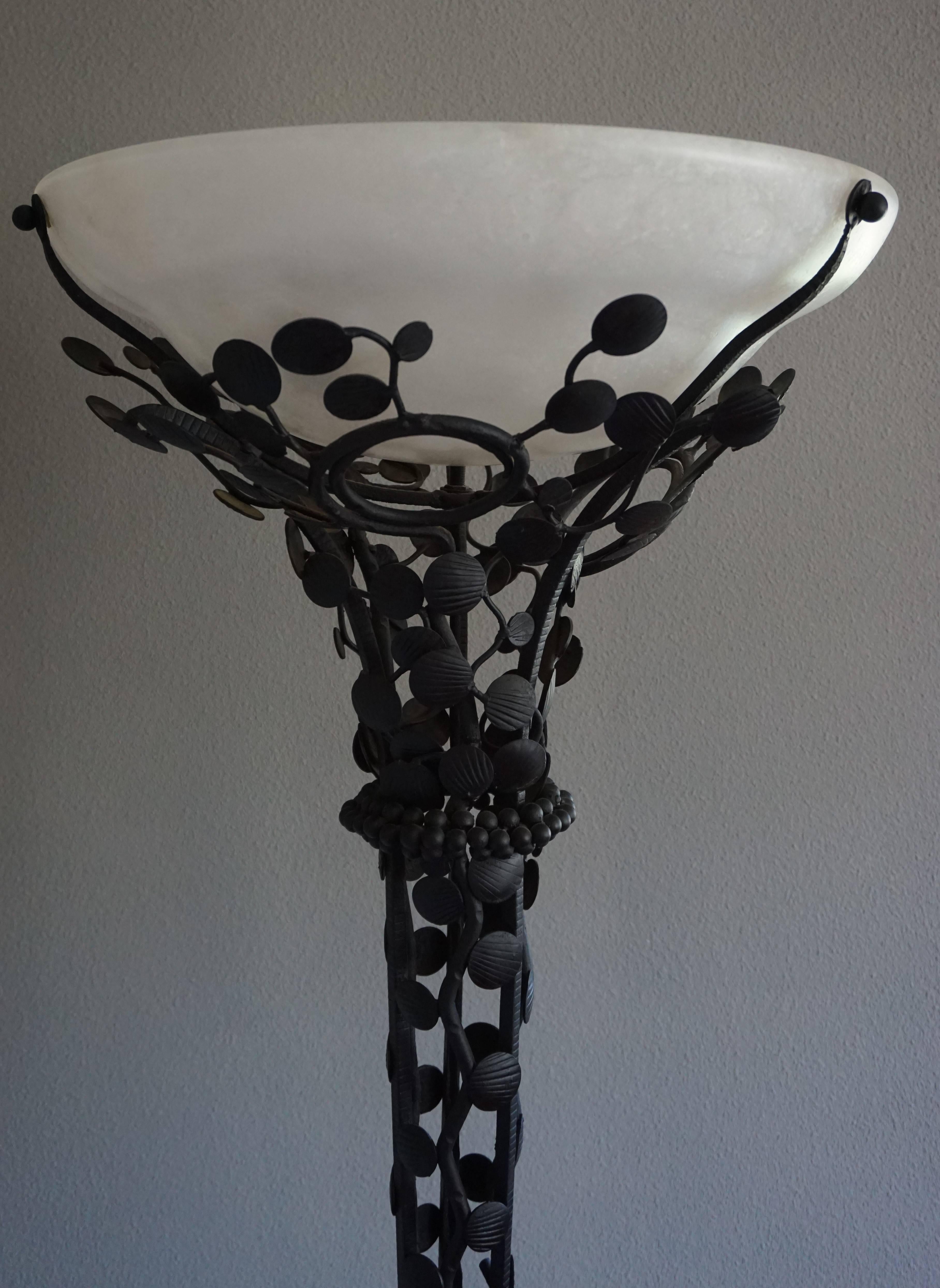 Handcrafted Art Deco floor lamp in the manner of Edgar Brandt.

Finding the right floor lamp for your Art Deco interior can be a pain in the rear, so finding this rare piece, to us, again felt like a blessing. The hand-forged and blackened,