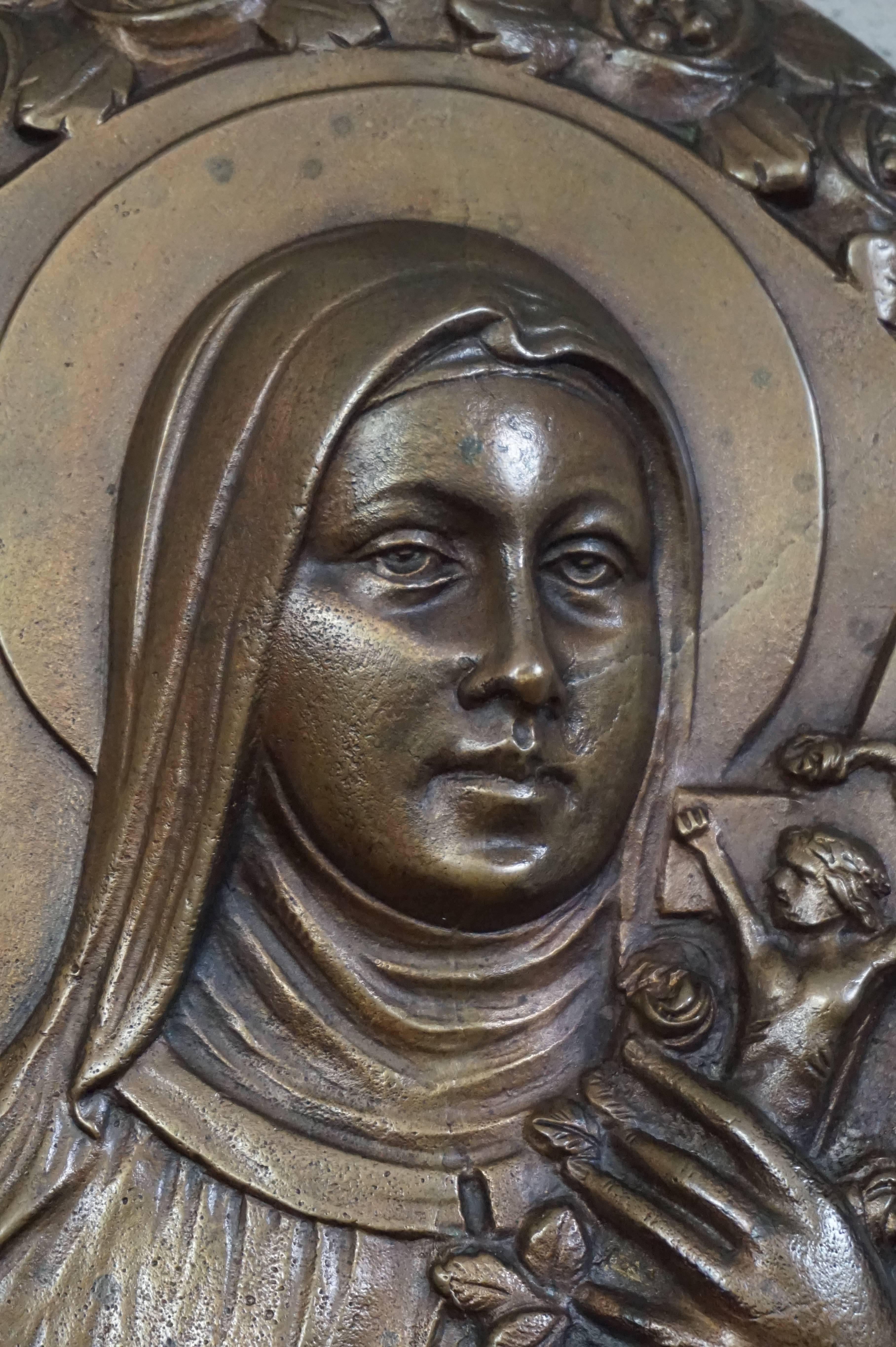 Religious Art Deco wall plaque of a very popular saint.

Saint Thérèse of Lisieux (1873-1897) is the patron saint of France and she is also known as Saint Thérèse of the Child Jesus and the Holy Face. She is popularly known as 'The Little Flower