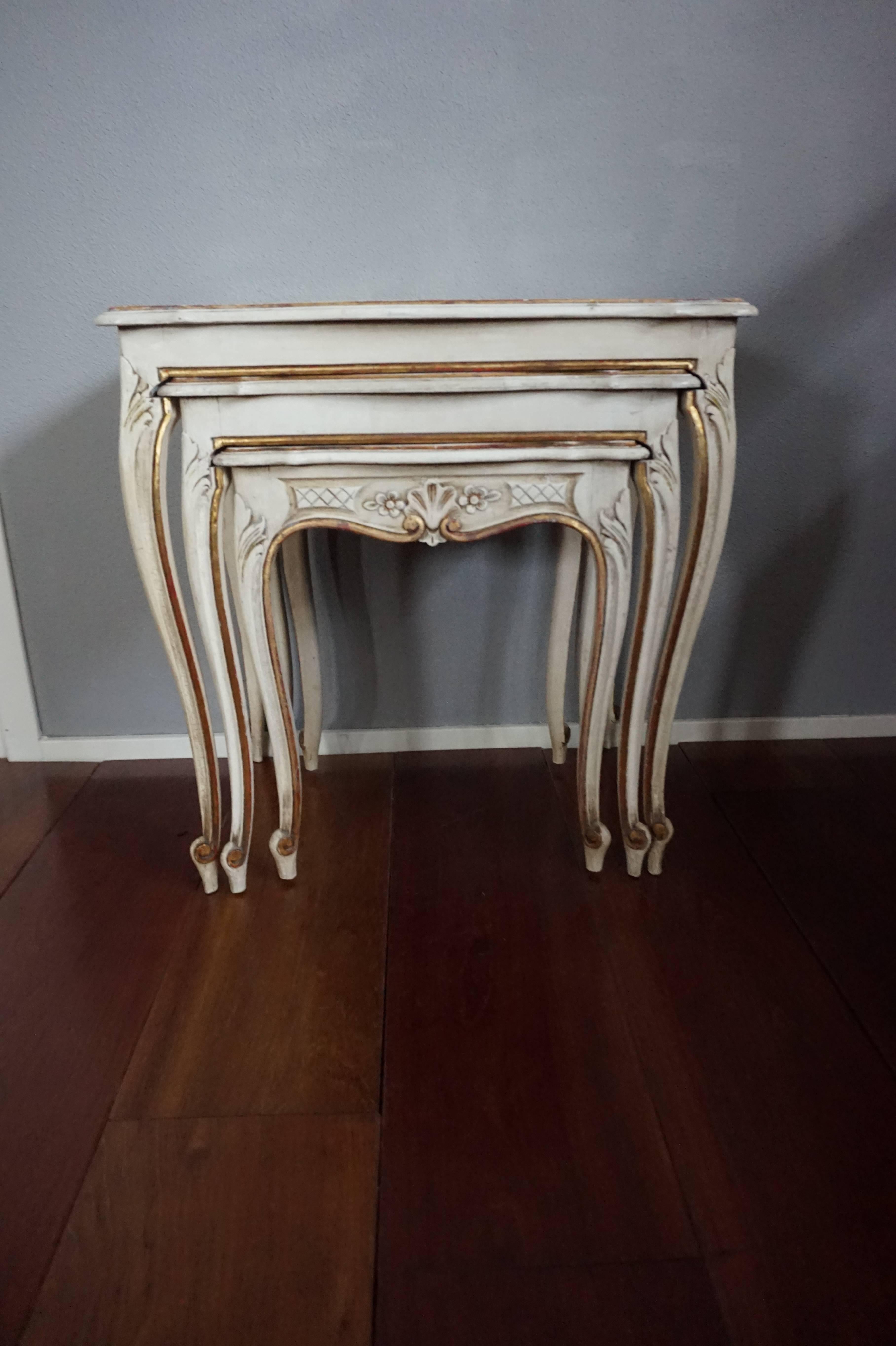 Stylish, elegant and practical nesting tables with original gilding.

This handcrafted set of small nesting tables is both beautiful and practical to use. All tables are still as stabile as the day they were made and they perfectly slide into each