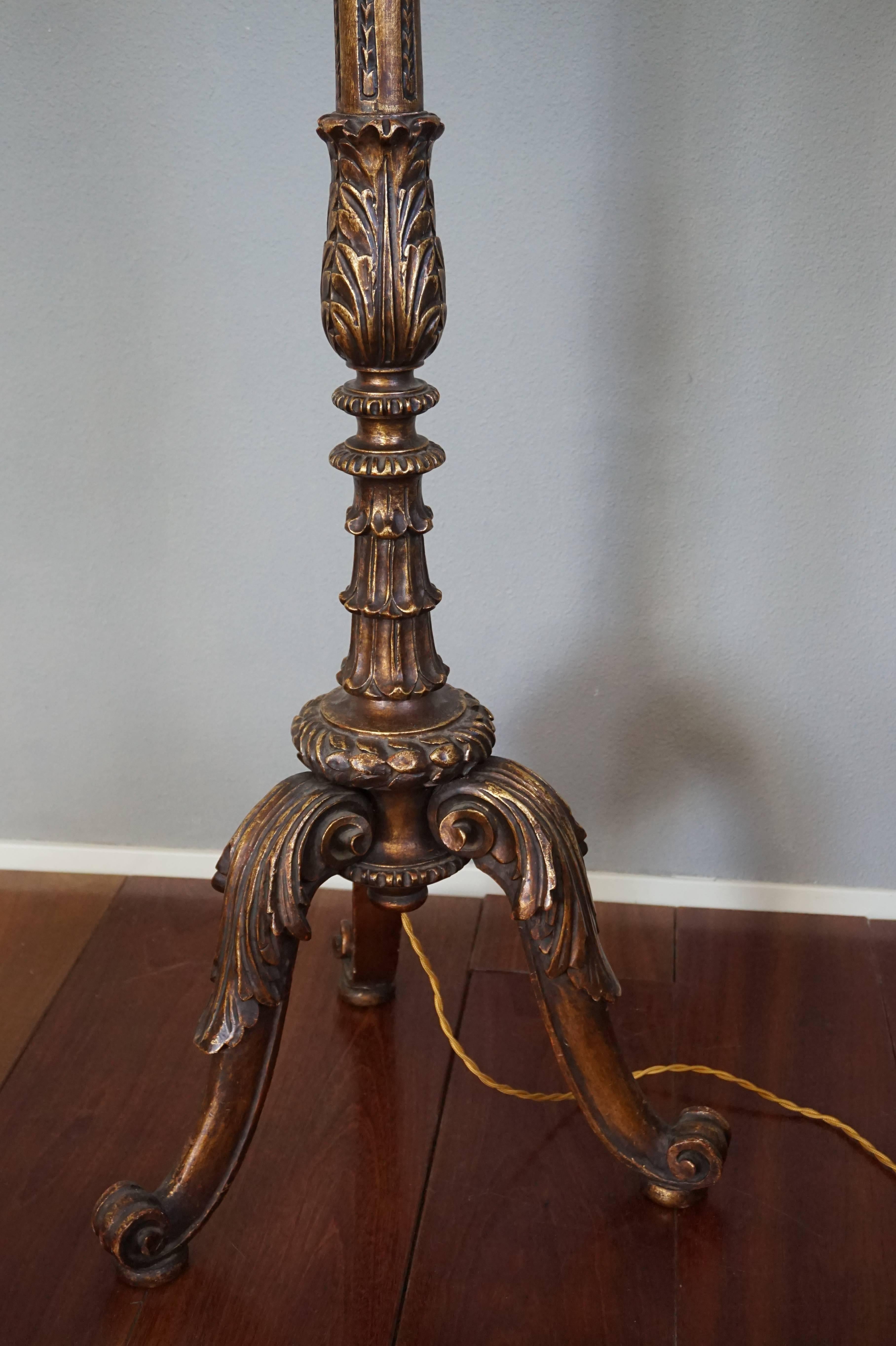 Stunning hand-carved floor lamp.

This beautiful quality and hand carved wooden floor lamp from the early 1900s is in mint condition. The typical Baroque shape and warm patina of this handcrafted lamp are a joy to look at, both with the light