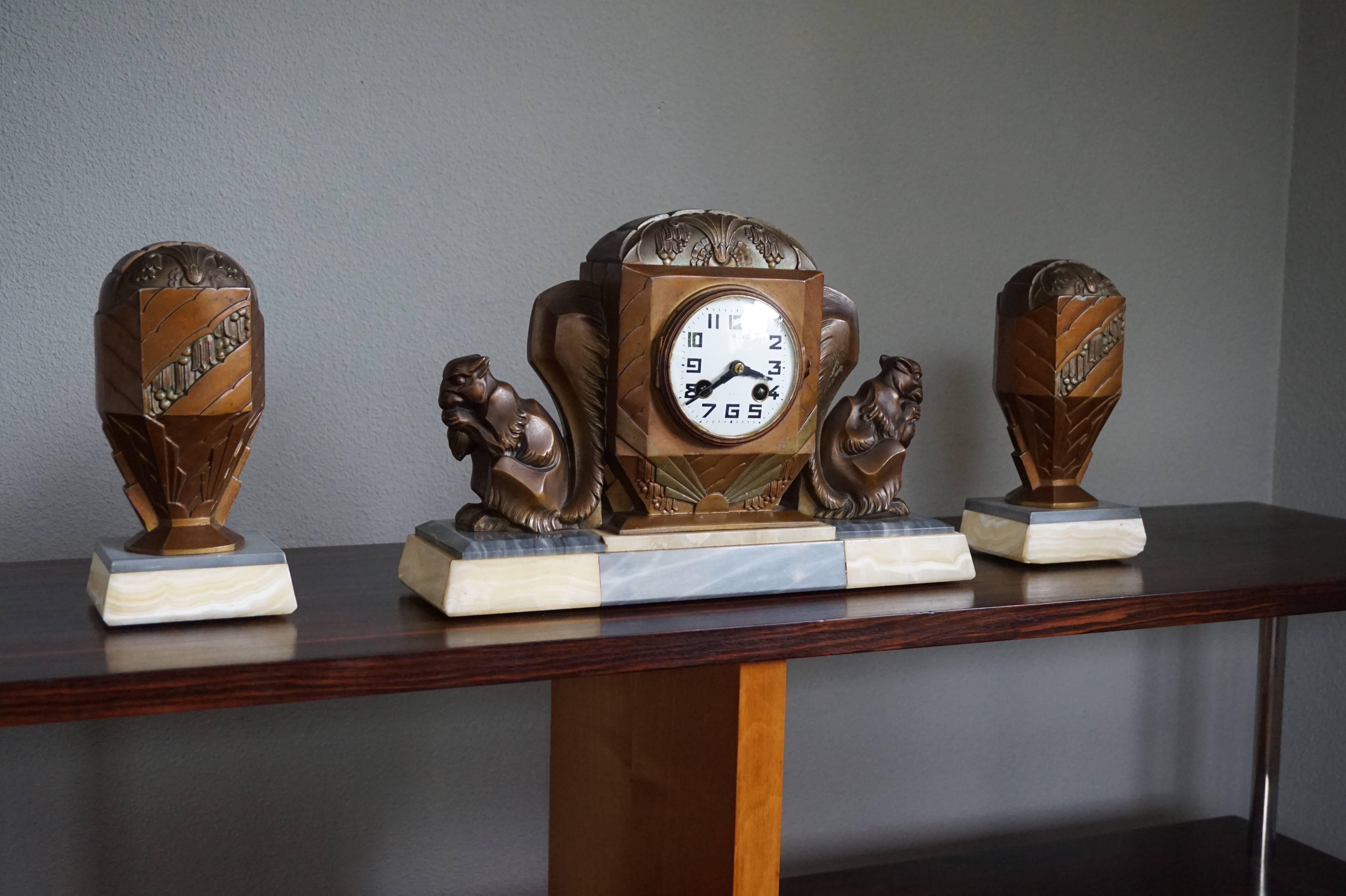 Rare and wonderful French Art Deco clock with squirrel sculptures.

If you are looking for a rare and highly decorative clock to grace your living space then this sculptural Art Deco specimen could be perfect for you. The combination of the light
