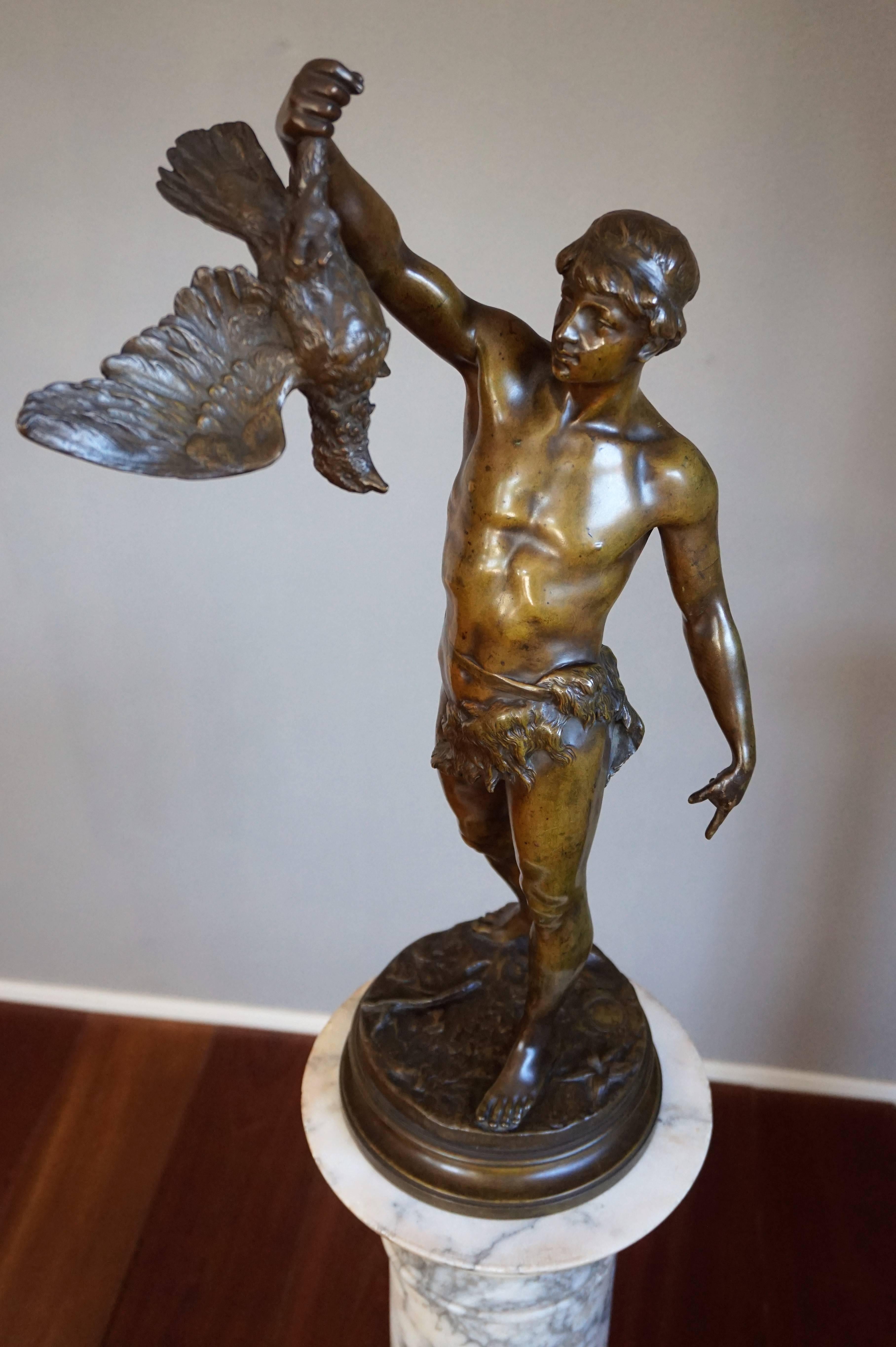 Rare and striking antique bronze sculpture by Georges Charles Coudray, (French, 1883-1932).

This almost nude, young male hunter holding a bird is by master sculptor Georges Coudray and it does not take a trained eye to see the quality in the