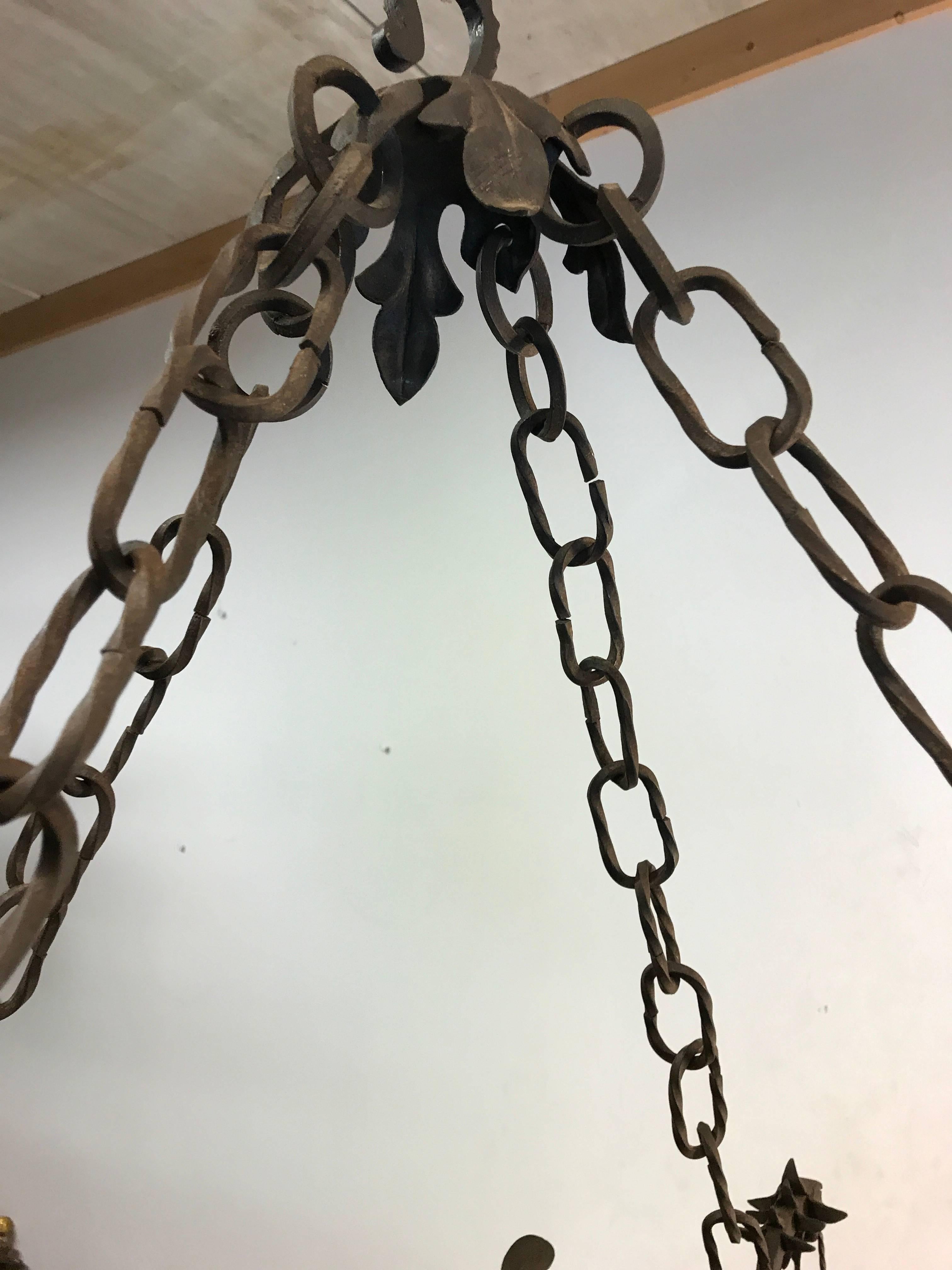 Italian Unique Hand Forged Wrought Iron Chandelier with Four Winged Griffin Sculptures For Sale