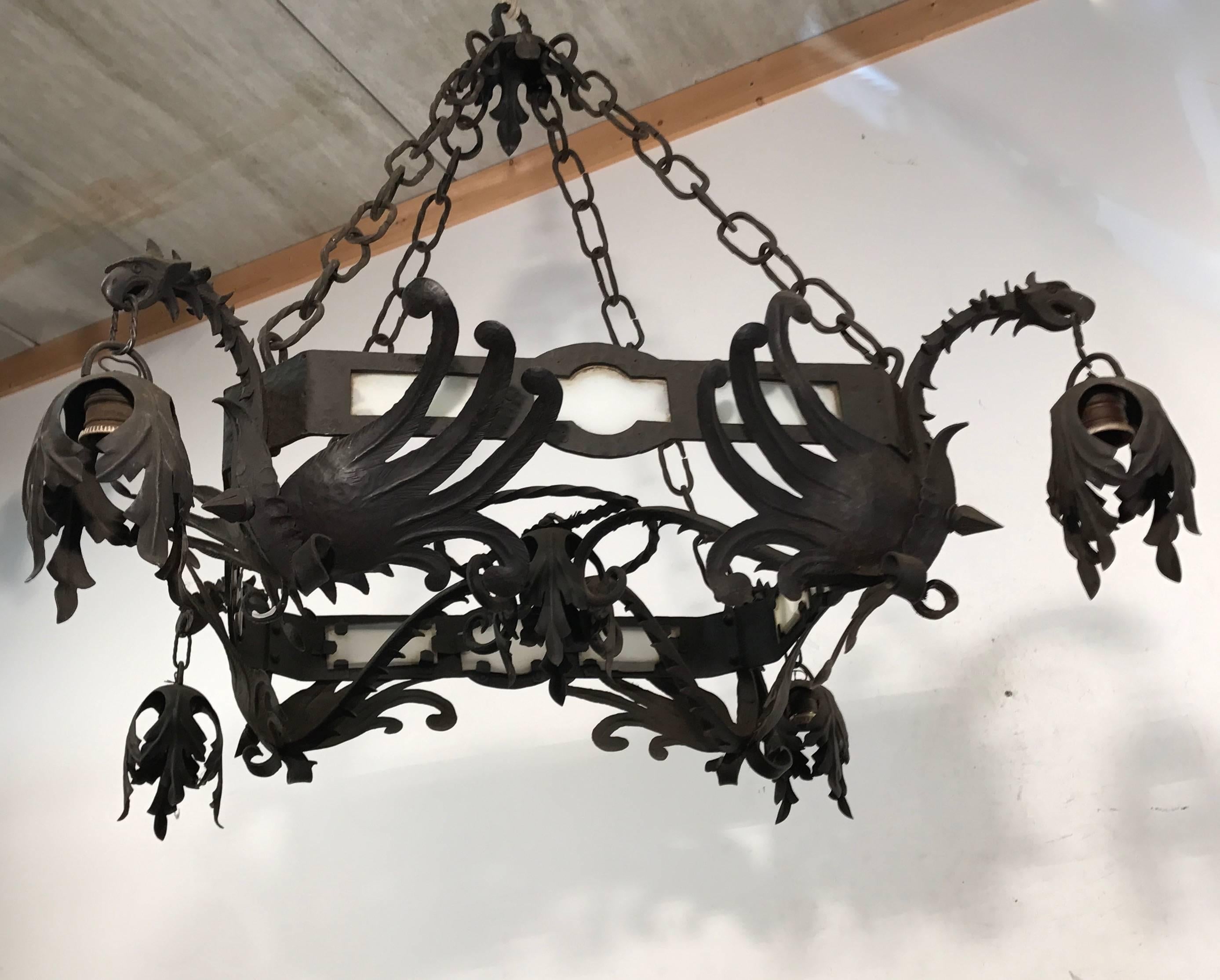 Glass Unique Hand Forged Wrought Iron Chandelier with Four Winged Griffin Sculptures For Sale