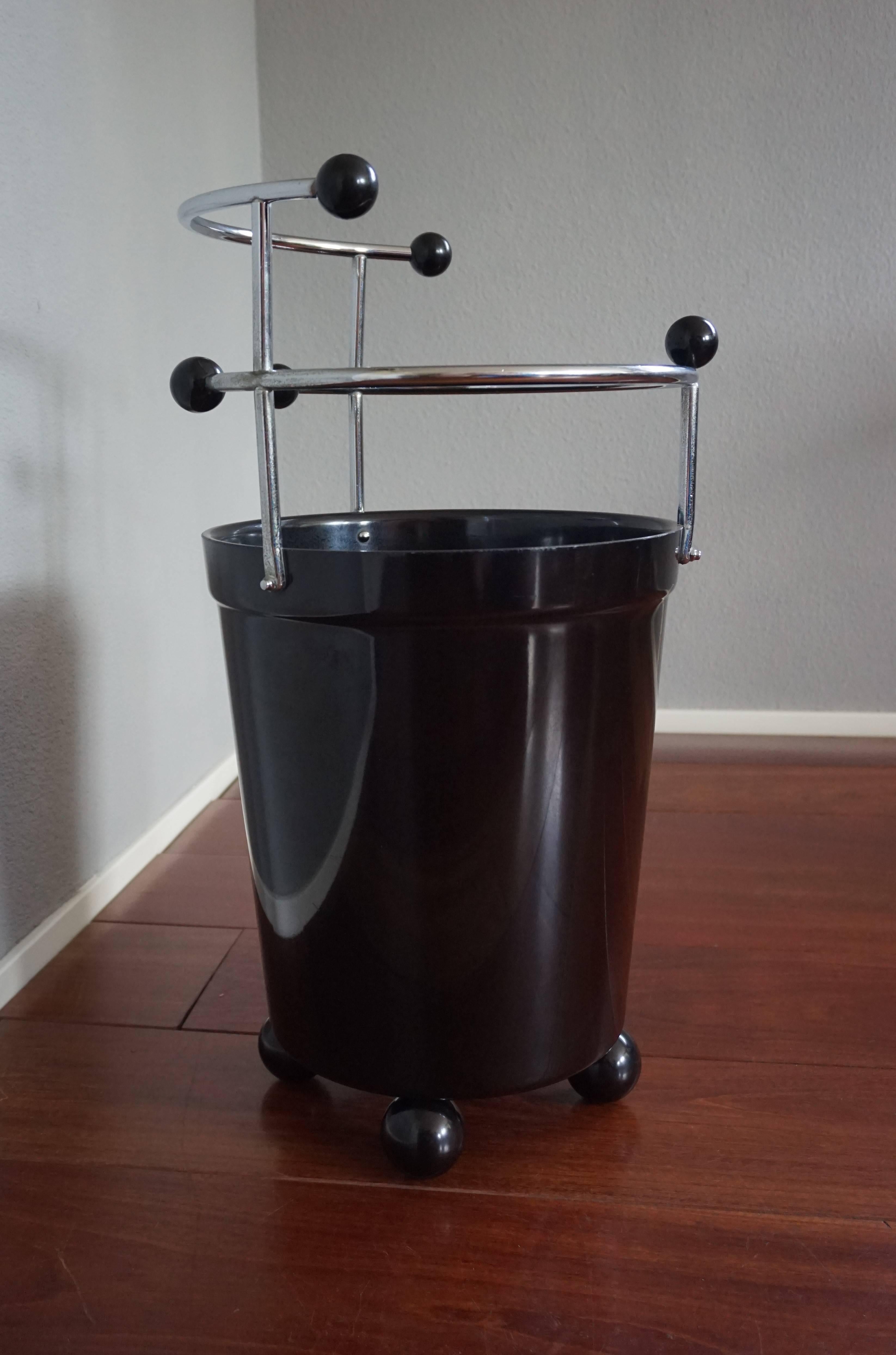 Extremely rare and possibly unique stand.

This impressive and inspiring European Art Deco umbrella and stick stand from the 1930s is an absolute joy to own, use and look at. The beautiful and thick, black bakelite bucket rests on four solid