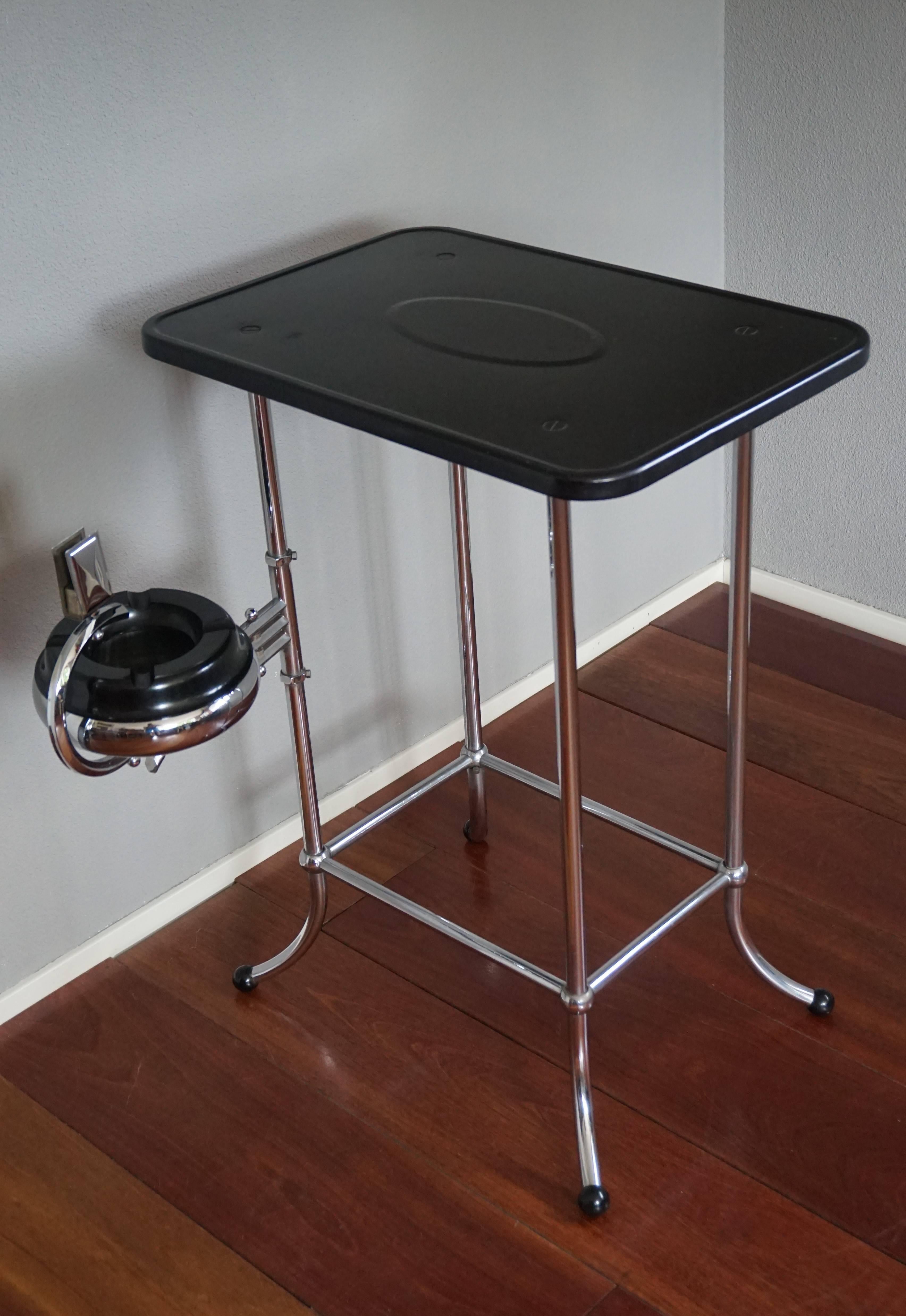 Rare, timeless and original Machine Age drinks table.

The combination of the sleek design and the wonderful materials makes this rare table highly desirable. The black painted metal top (original) shows some signs of usage, but other than that the