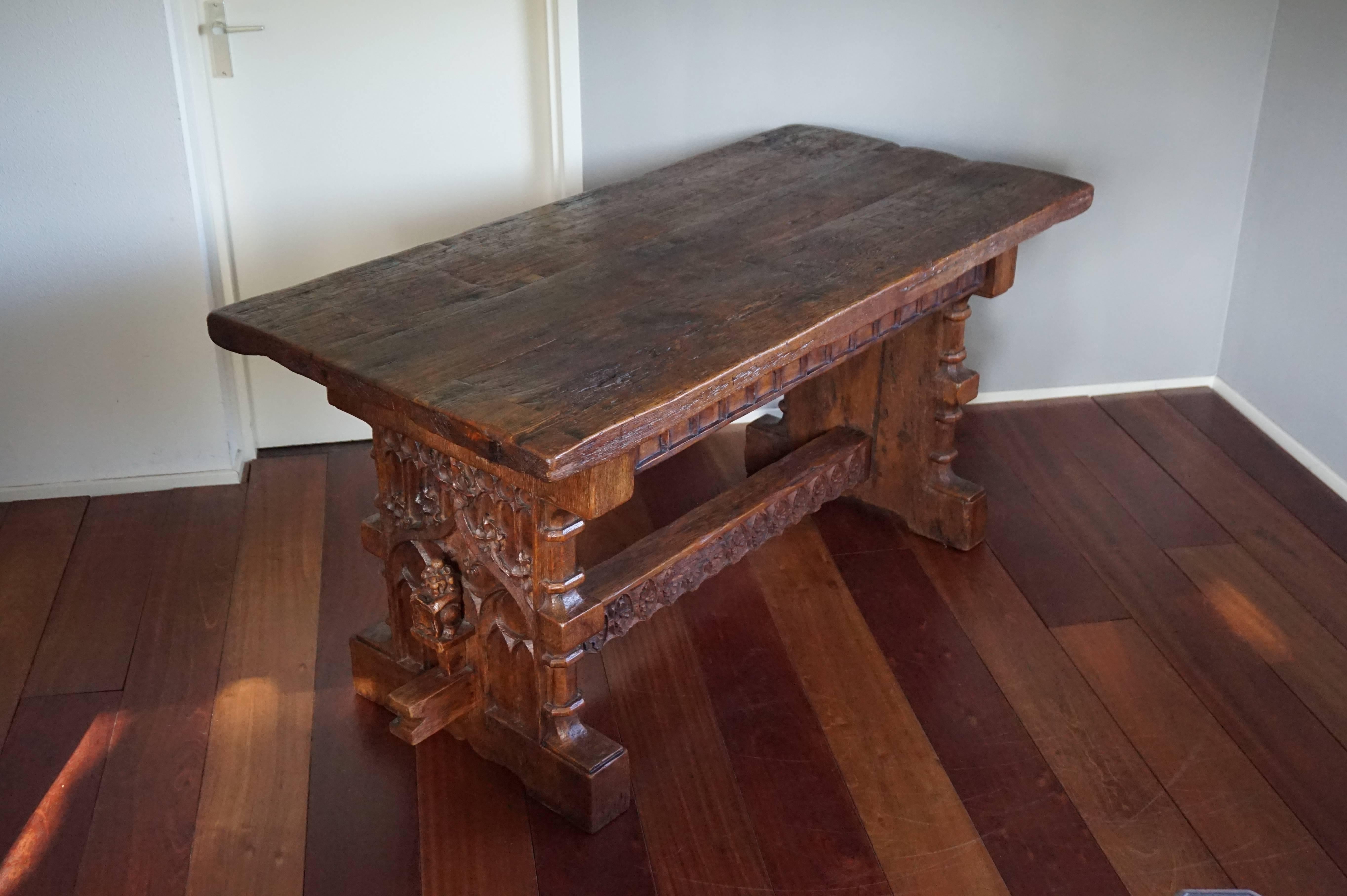 Unique and heavy built, turn of the century Gothic Revival table.

This stunning table looks like it was made in the 15th century, but we feel someone in the early 20th century has gone to great length (and has done a great job) in making this table