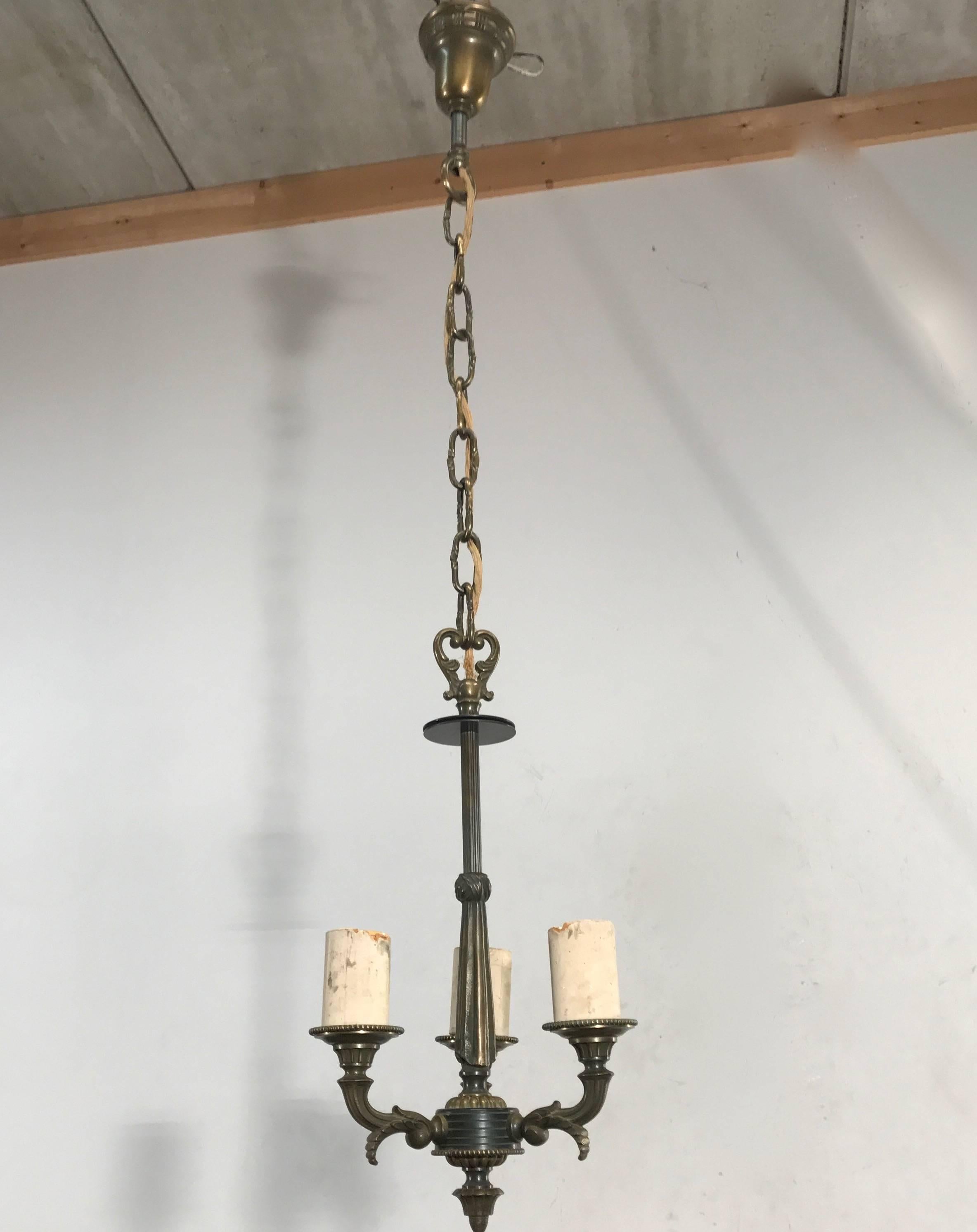 Rare size chandelier from the 1920s.

If you look at the shape of the centre and the shape of the arms that grow out of this pendant then you capture the essence of it. It is stylish, timeless and, unlike most home accessories that you find in