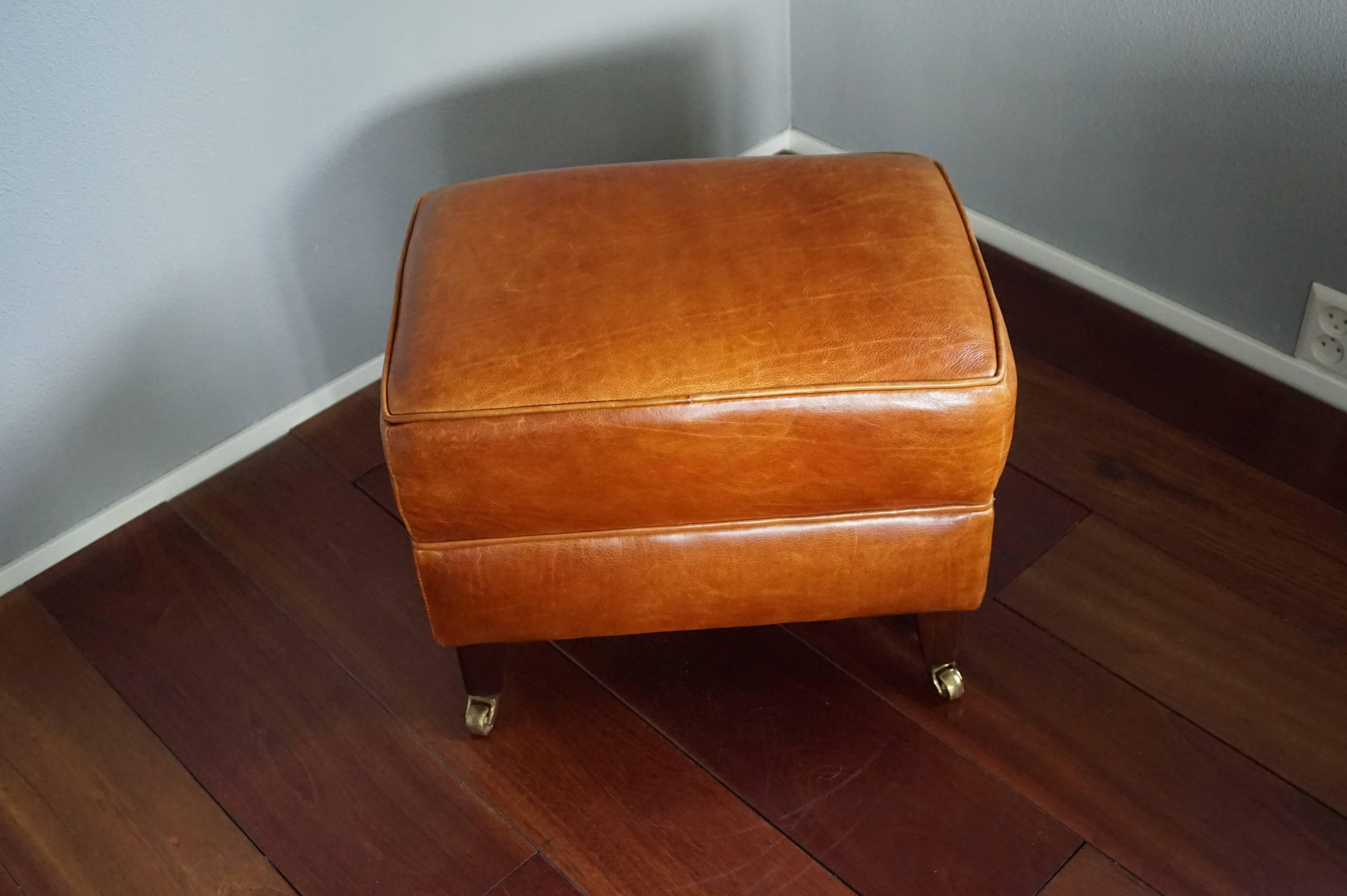 Timeless design ottoman with top quality leather.

This finest quality ottoman will look great as a footstool with a leather Art Deco armchair, but also as a small bench near your fireplace or in your hallway. It looks great and it sits and feels
