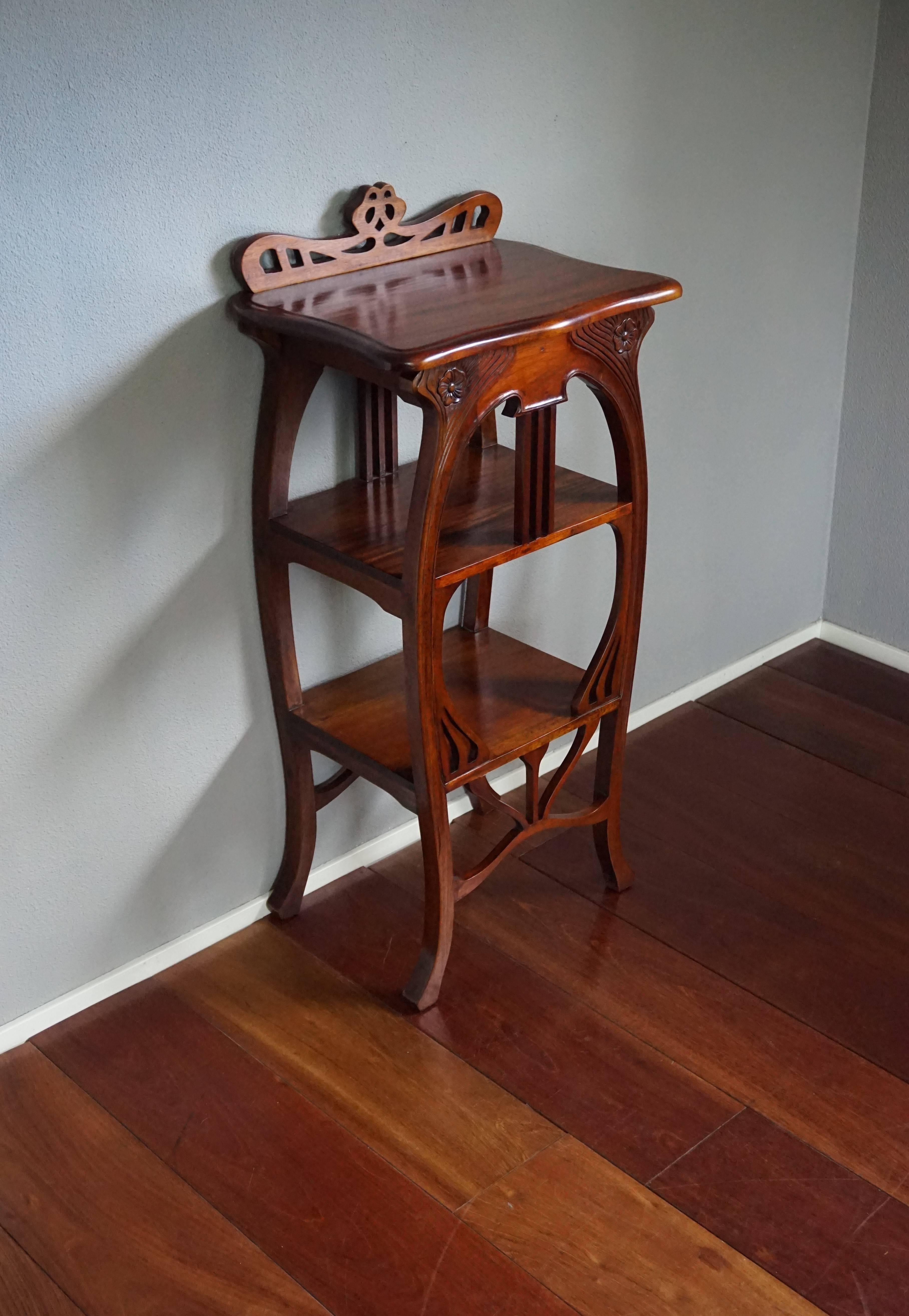 Beautiful and practical Art Nouveau style table.

This fine looking and remarkable condition table in the Art Nouveau style is entirely made of solid teak wood. Thanks to the elegant shape and the wonderful color it is absolute joy to own and look