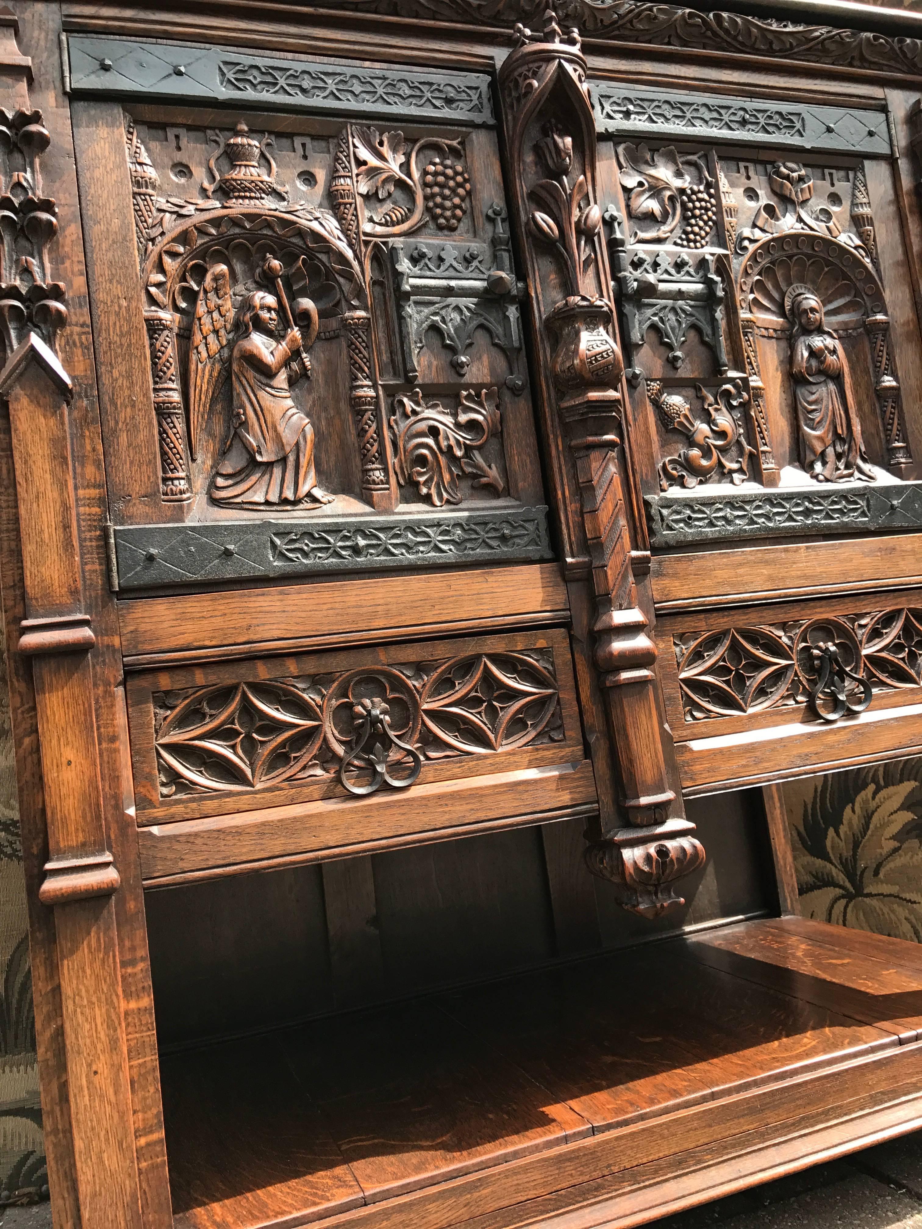 Hand-Carved Gothic Revival Carved Oak Cabinet Depicting The Annunciation To The Virgin Mary