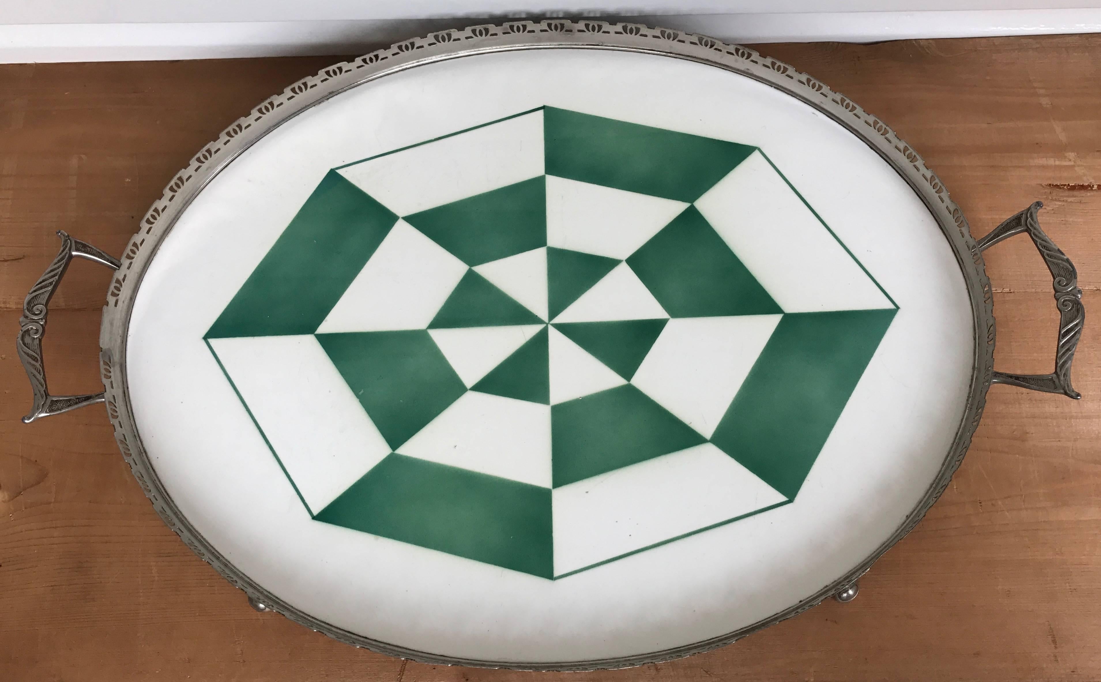 Beautiful and large Art Deco tray. 

This rare Art Deco serving tray with the beautiful, geometrical pattern is in excellent condition. It will look terrific atop a drinks cabinet, dresser, side table etc. The one-piece, oval tile is in perfect