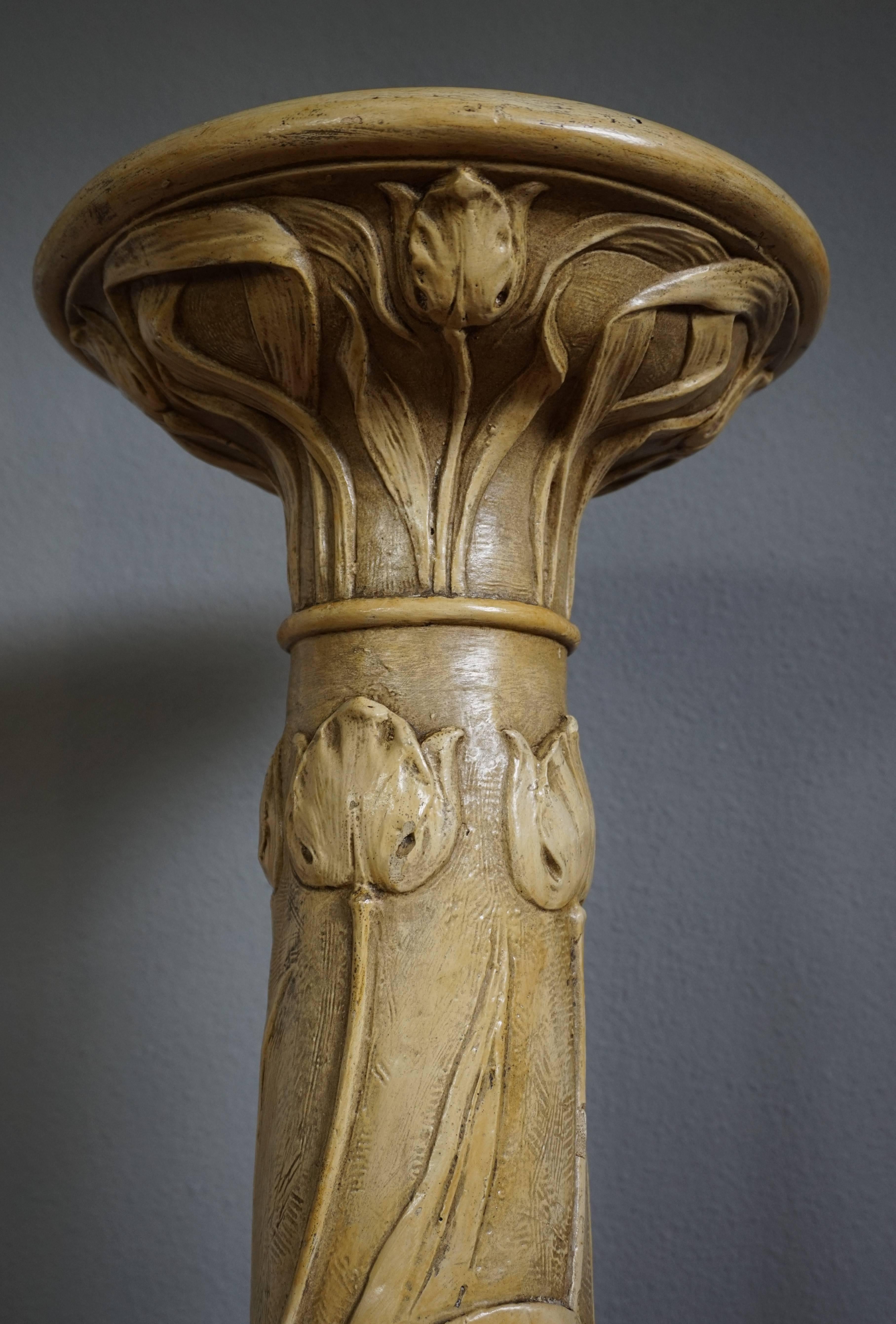 Antique Art Nouveau stand with maker's signature.

This rare Art Nouveau pedestal comes with various, elegant and organically flowing flower motifs in relief. These Art Nouveau home accessories are very rare, because of their relative fragility. To