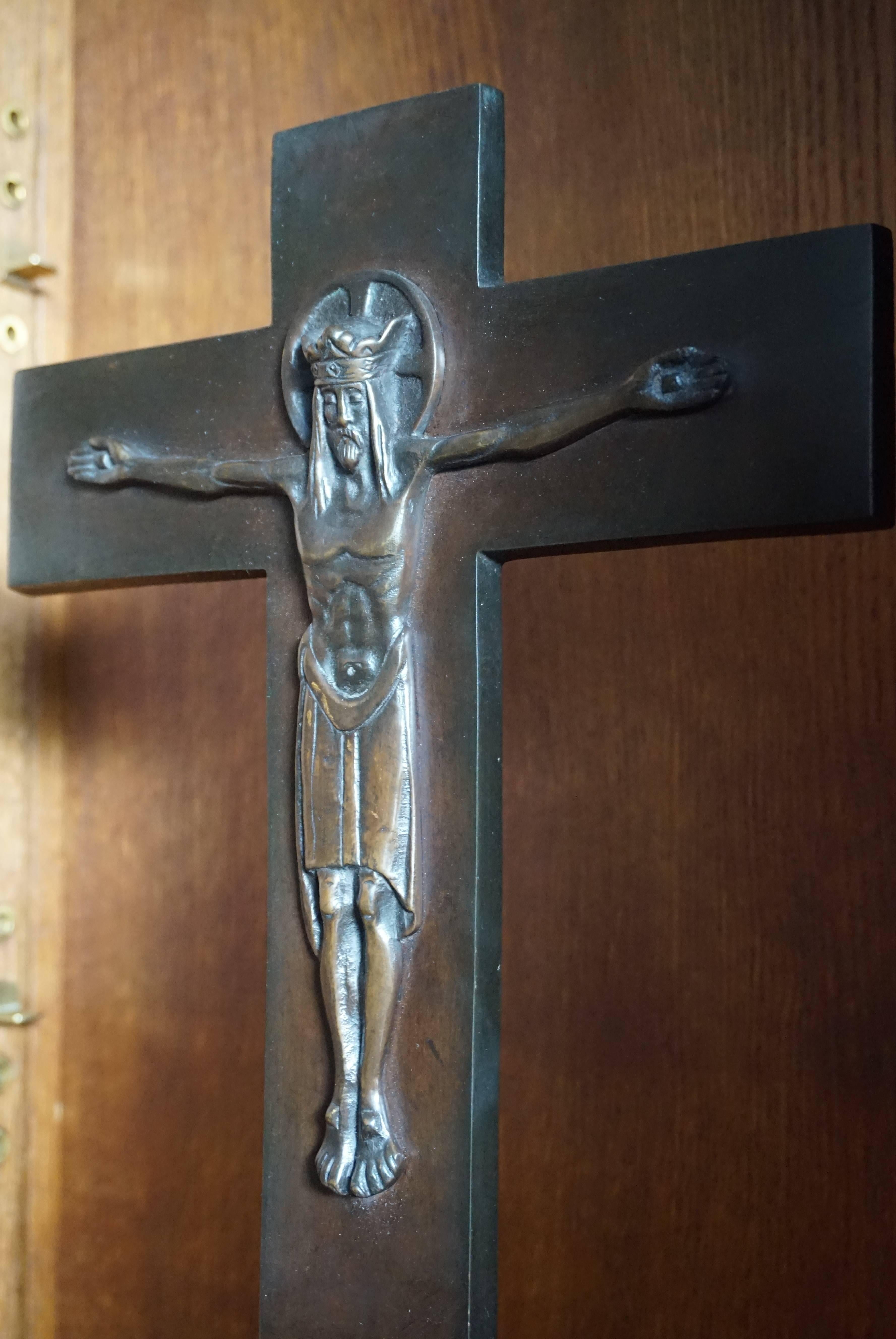 Practical size, all bronze Art Deco crucifix.

This rare and handcrafted, bronze crucifix stands on a good size, integrated base. It dates from 1910-1920 and you can tell by the extra rectangular shape that it is very much Art Deco in style and