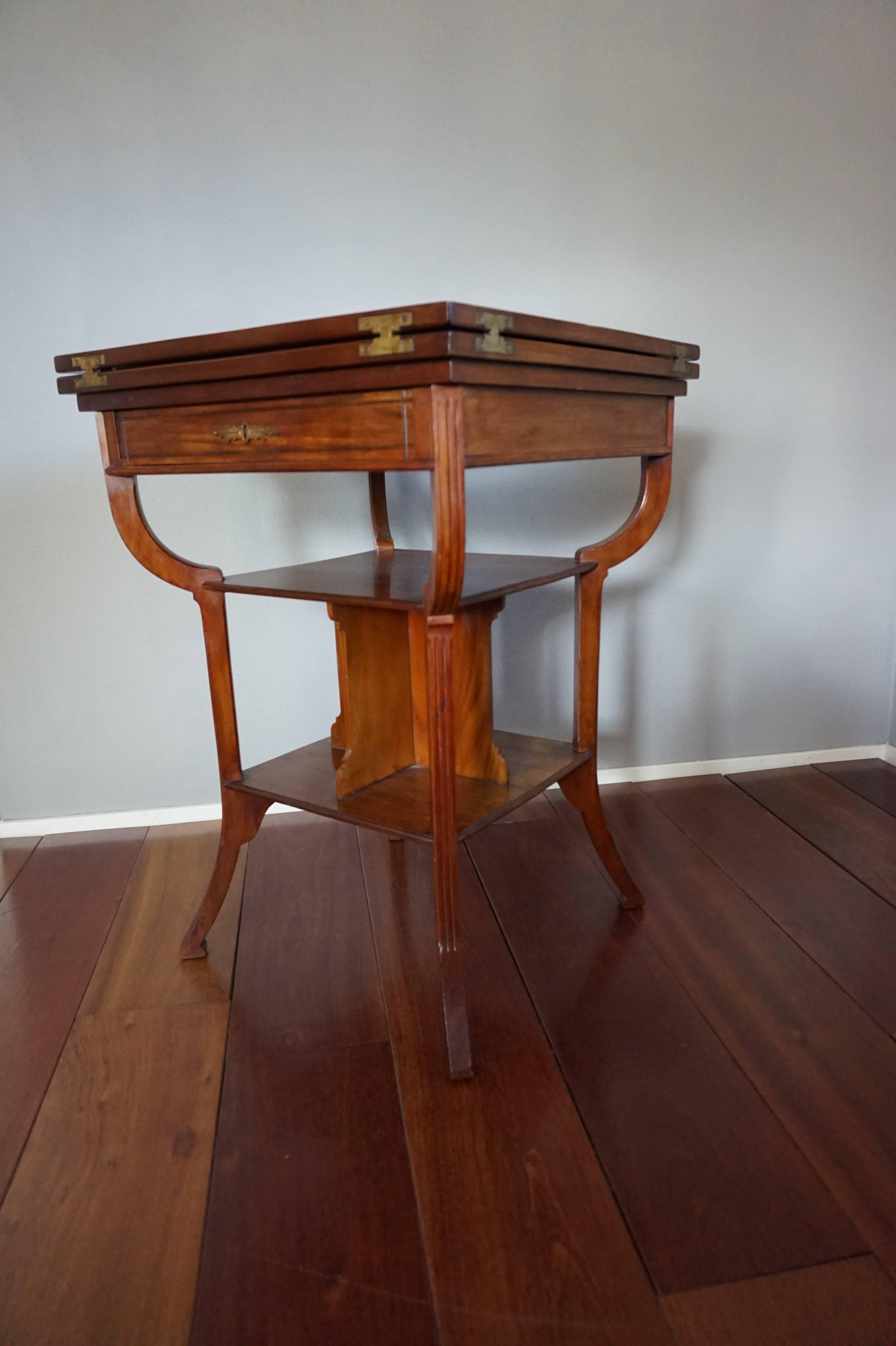 Top quality and condition games table with integrated bookcase and drawer.

This rare and impressive games table by one of Holland's finest furniture designers/makers from the turn of the century is in excellent condition. This beautiful timber