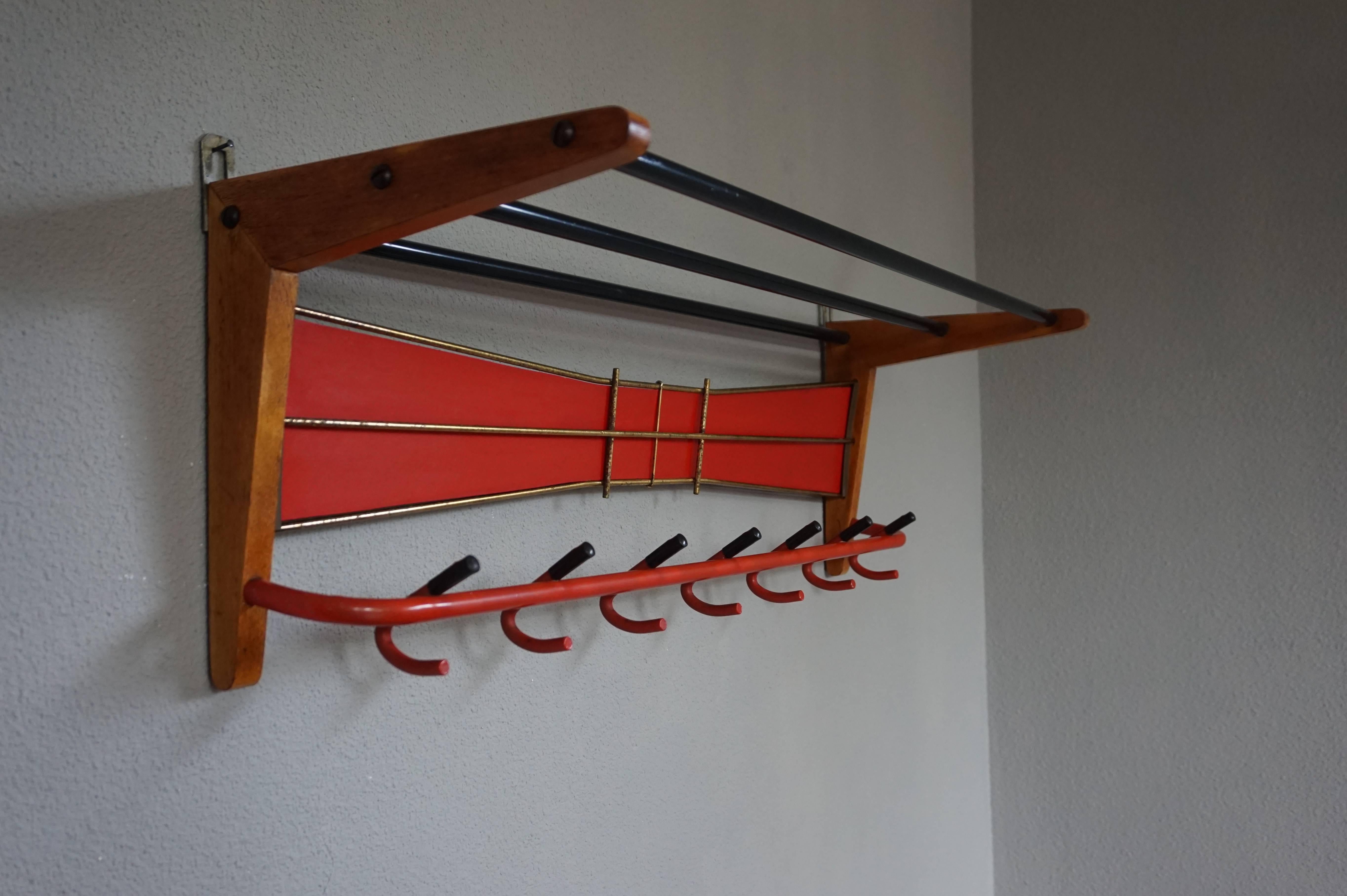Rare and stylish Mid-Century coat rack.

For the collectors of European Mid-Century Furniture we also have this rare design coat rack. Its symmetrical and 'open' design in combination with the primary colors is a joy to watch. For it to also be