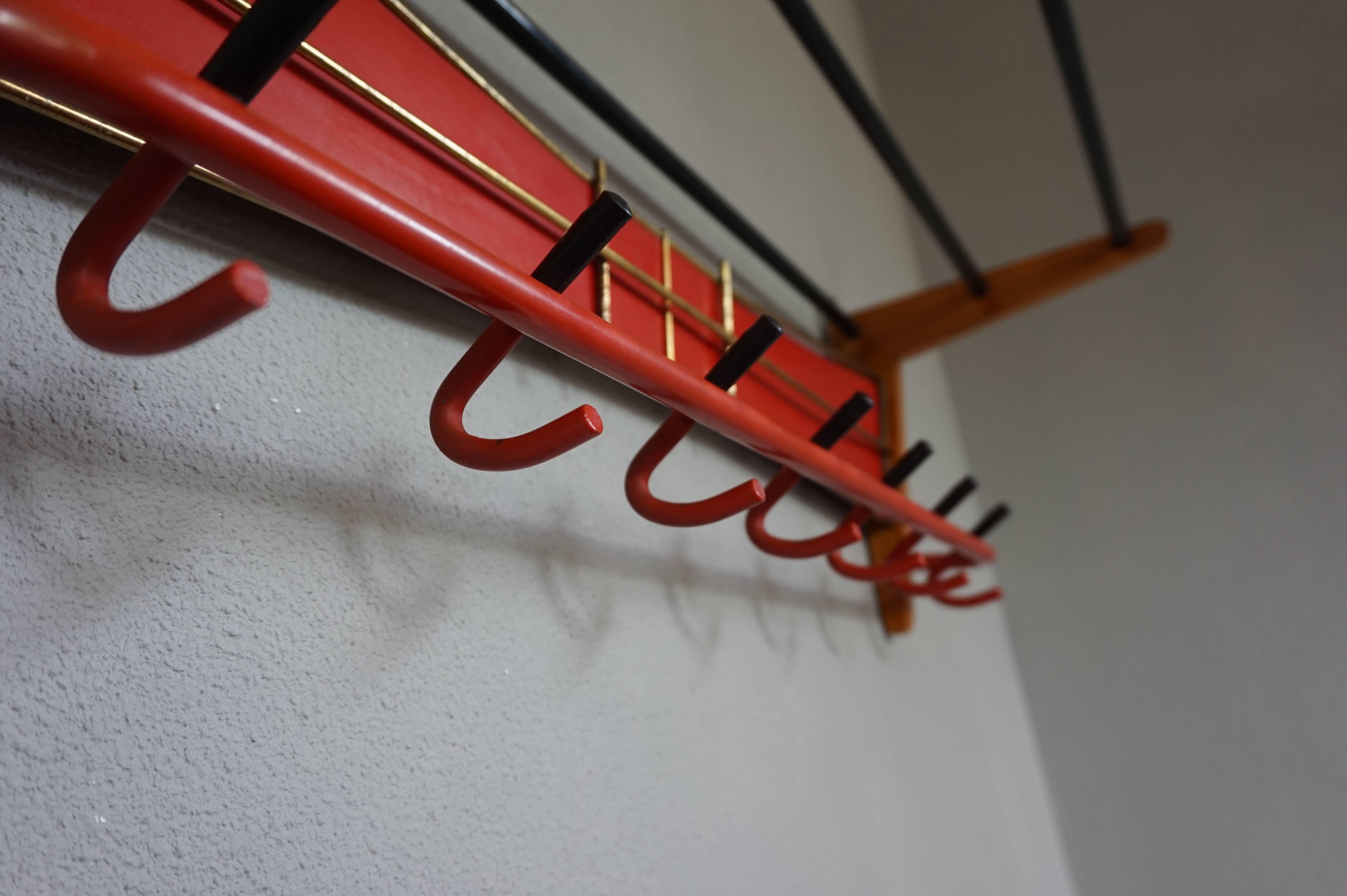 European Mid-Century Modern Wood, Brass and Plastic, Red and Black Coat and Hat Rack For Sale