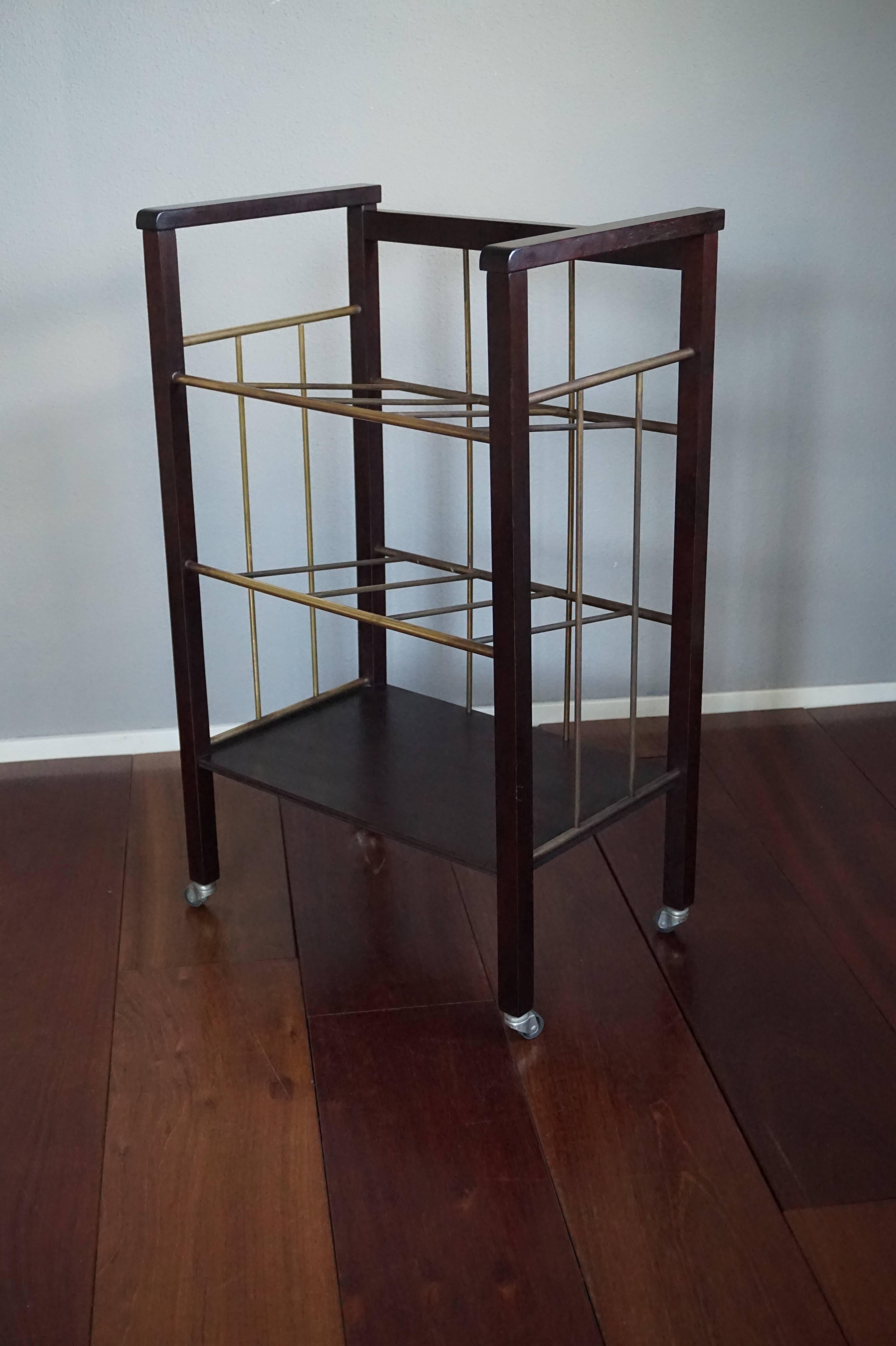 Finest quality and condition Viennese stand.

This stunning and highly practical stand is made of ebonized wood and brass. This timeless antique stood next to the black piano of the former owner, who kept her sheet music in this rack. For a piece