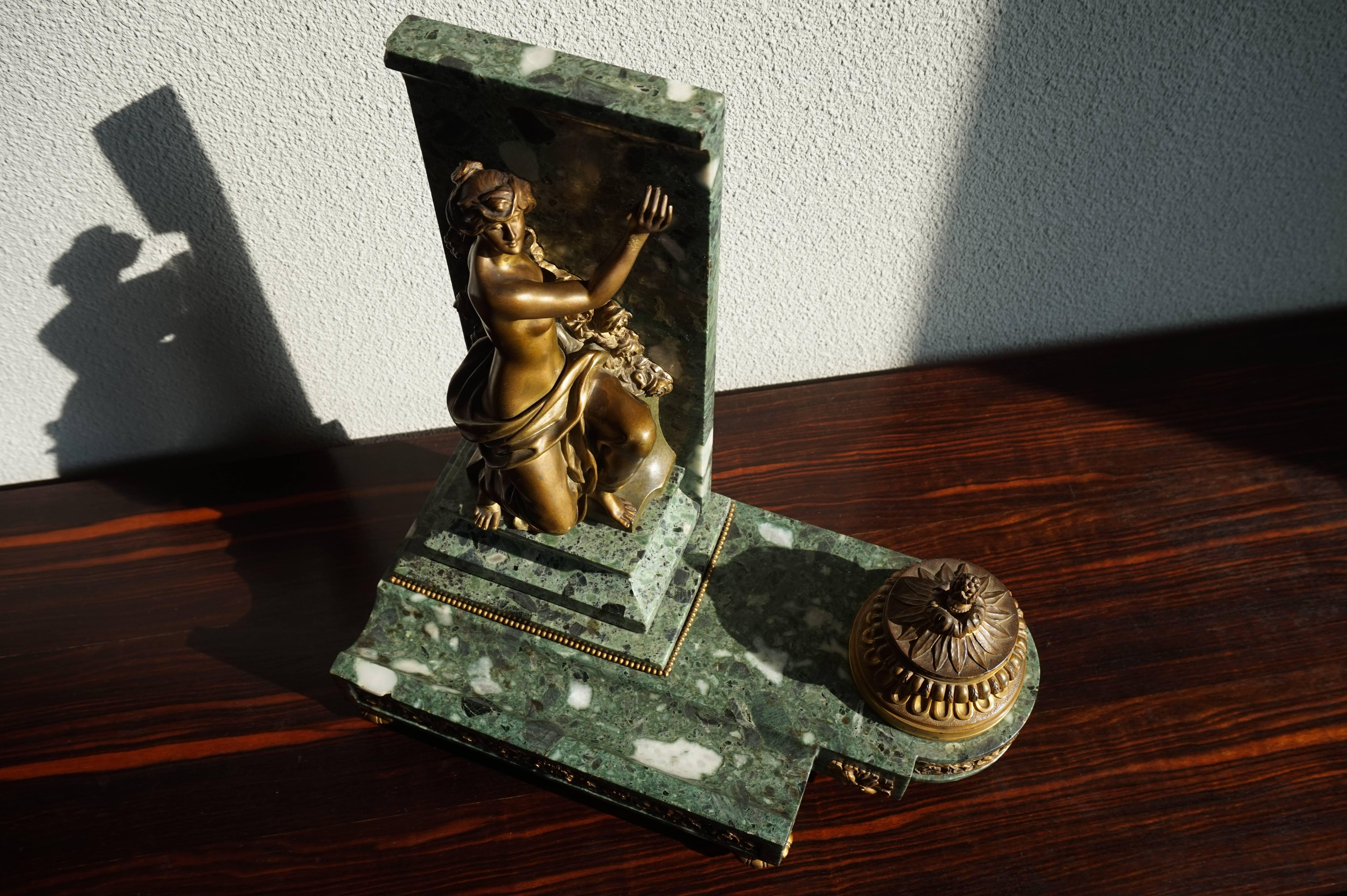 Rare and important French Napoleonic ink stand with female sculpture.

This hand-crafted and sizable ink stand of marble and gilt bronze is signed by the renowned French sculptor Marcel Debut (Paris, 1865-1933). The perfect anatomy and stunning