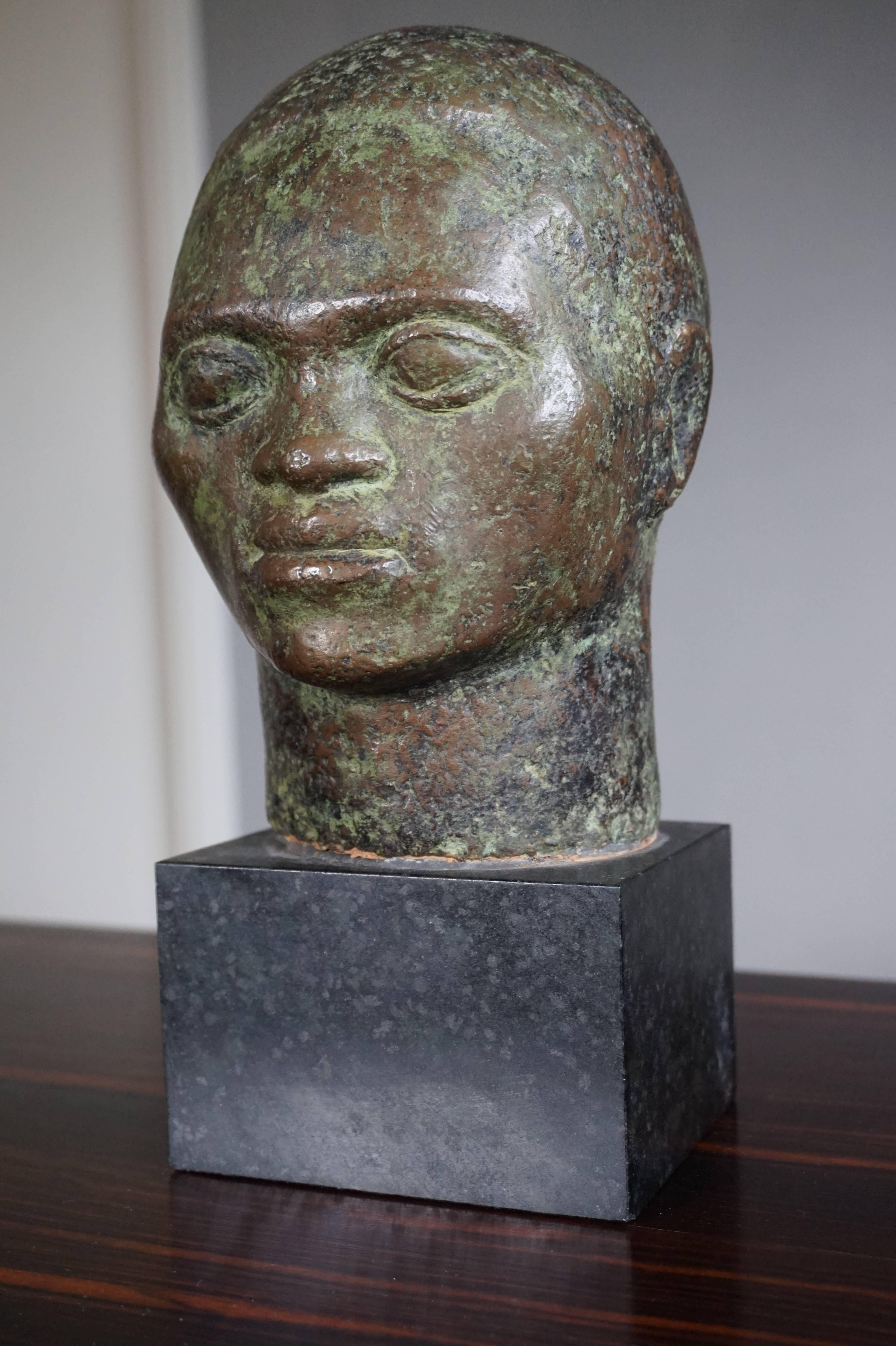 Unique bronze sculpture and a fine work of art.

This serene yet strong face on an evenly strong neck 'spoke to me'. For me that has always been the best reason for purchasing an antique or a work of art. The surface of this bronze and its patina