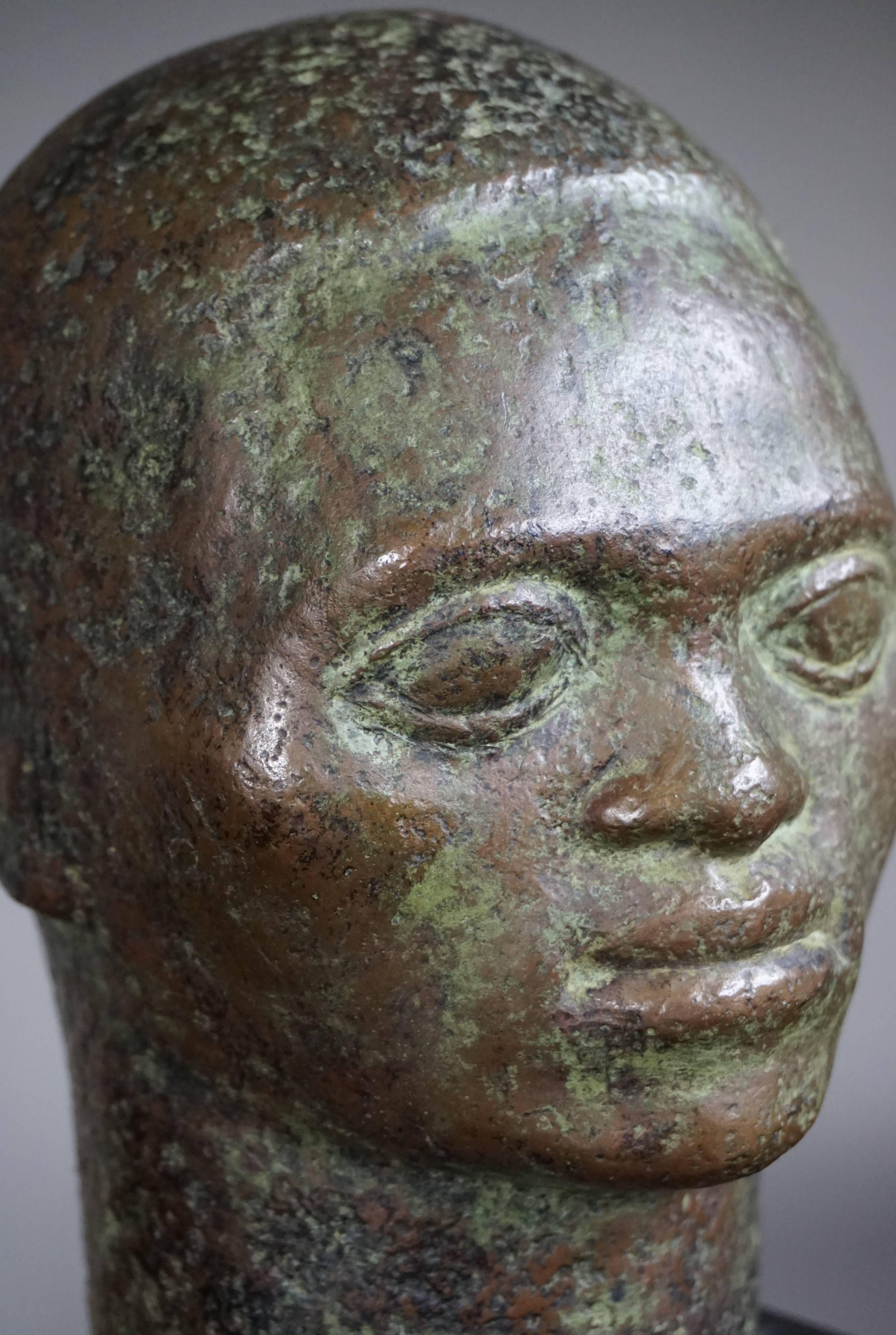 Cast Small to Mid Size, Rare and Serene African Male Bronze Bust on Black Marble Base