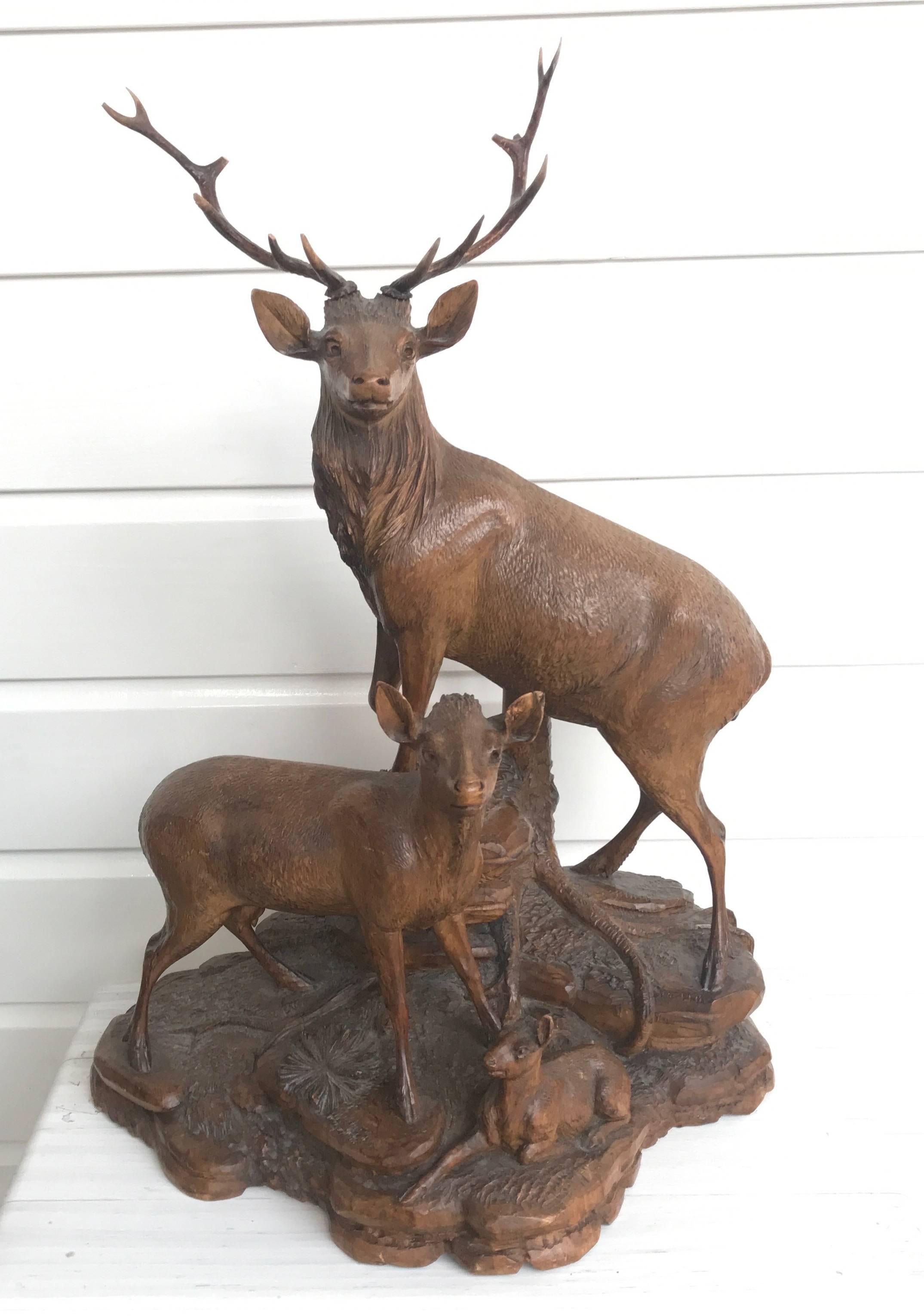 Exceptionally carved red deer group.

This majestic stag with antlers is clearly the head of his family. The master carver who created this impressive center piece in the late 1800s has done an outstanding job in portraying this deer family. The