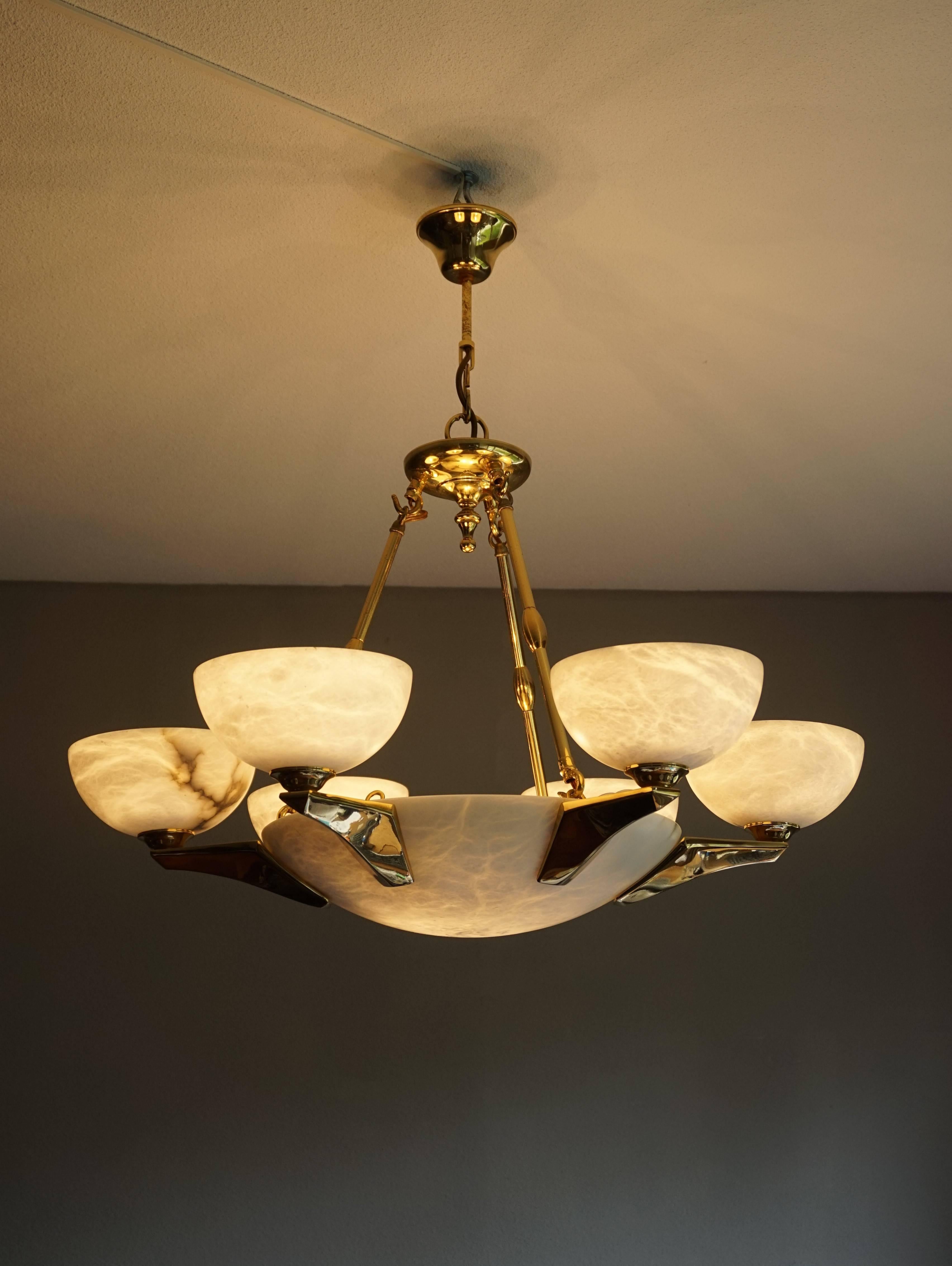 Excellent condition Spanish or Italian, Art Deco style chandelier.

If you like Art Deco chandeliers and pendants, but you would rather have them look like new then this 1970s alabaster shades and bronze arms light fixture could be perfect for