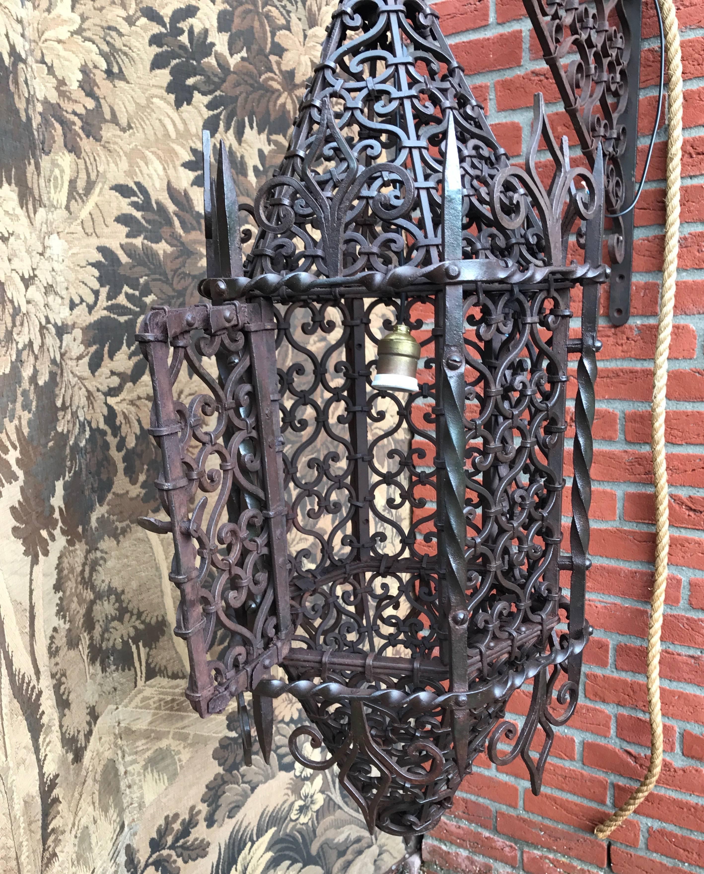 Unique, stunning and all handcrafted work of antique lighting art.

The amount of time that must have gone into designing and hand-forging this Moorish style light fixture is incredible. There are so many, individually forged and perfectly shaped