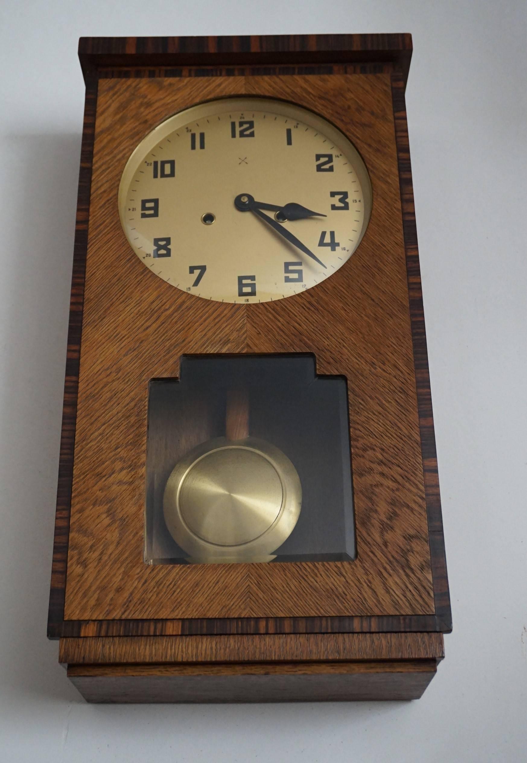 Early 20th century, great condition Art Deco wall clock.

Over the years we have sold a few dozen Amsterdam School pendulums. They were all beautiful and unique in design, but they ARE out there. However, wall clocks from this typical Dutch Art Deco