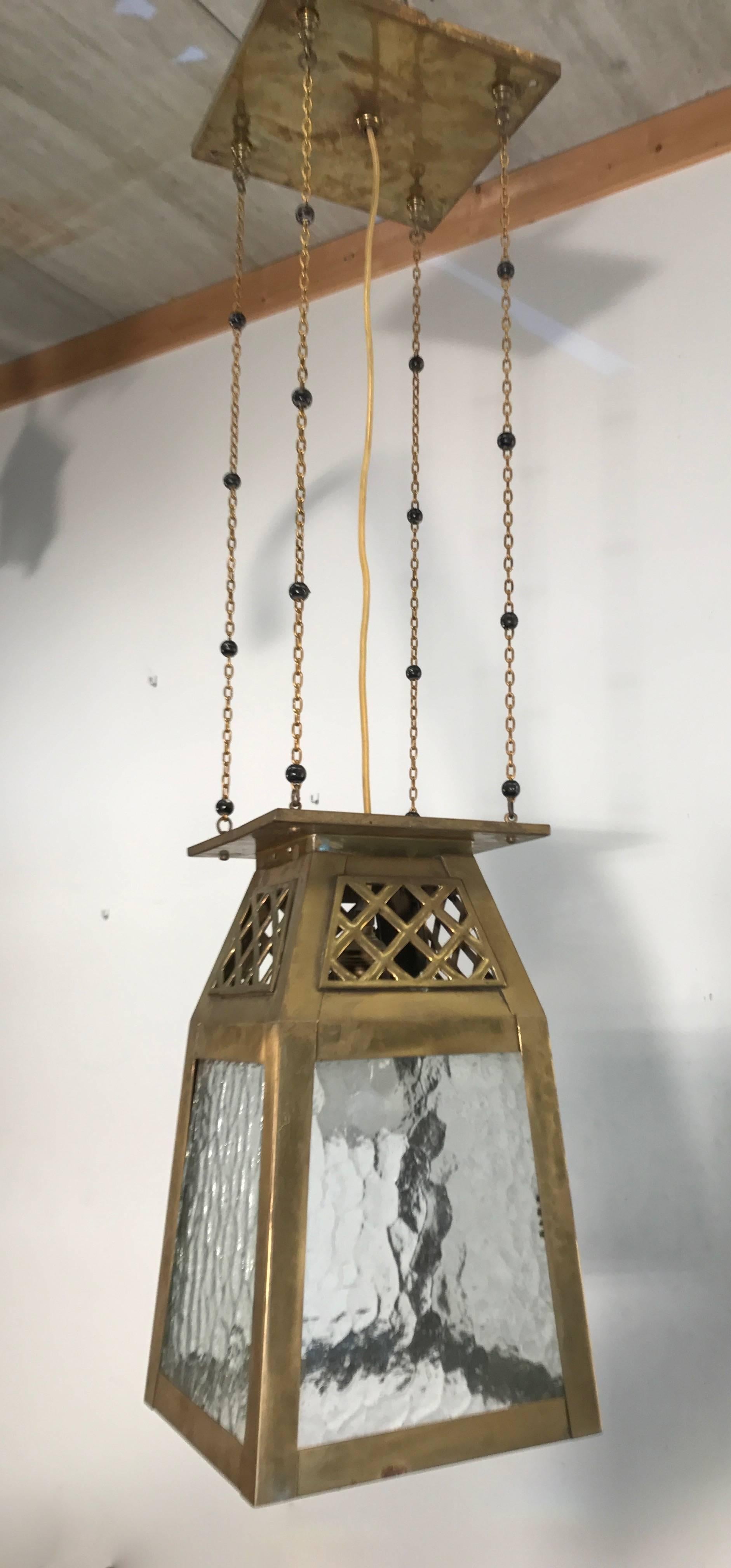 Beautiful and all handcrafted Arts & Crafts ceiling lamp.

If you have a home or an office that dates from the early 1900s and/or if you are a collector of stylish, Arts and Crafts home accessories than you will love the shape and the look and feel