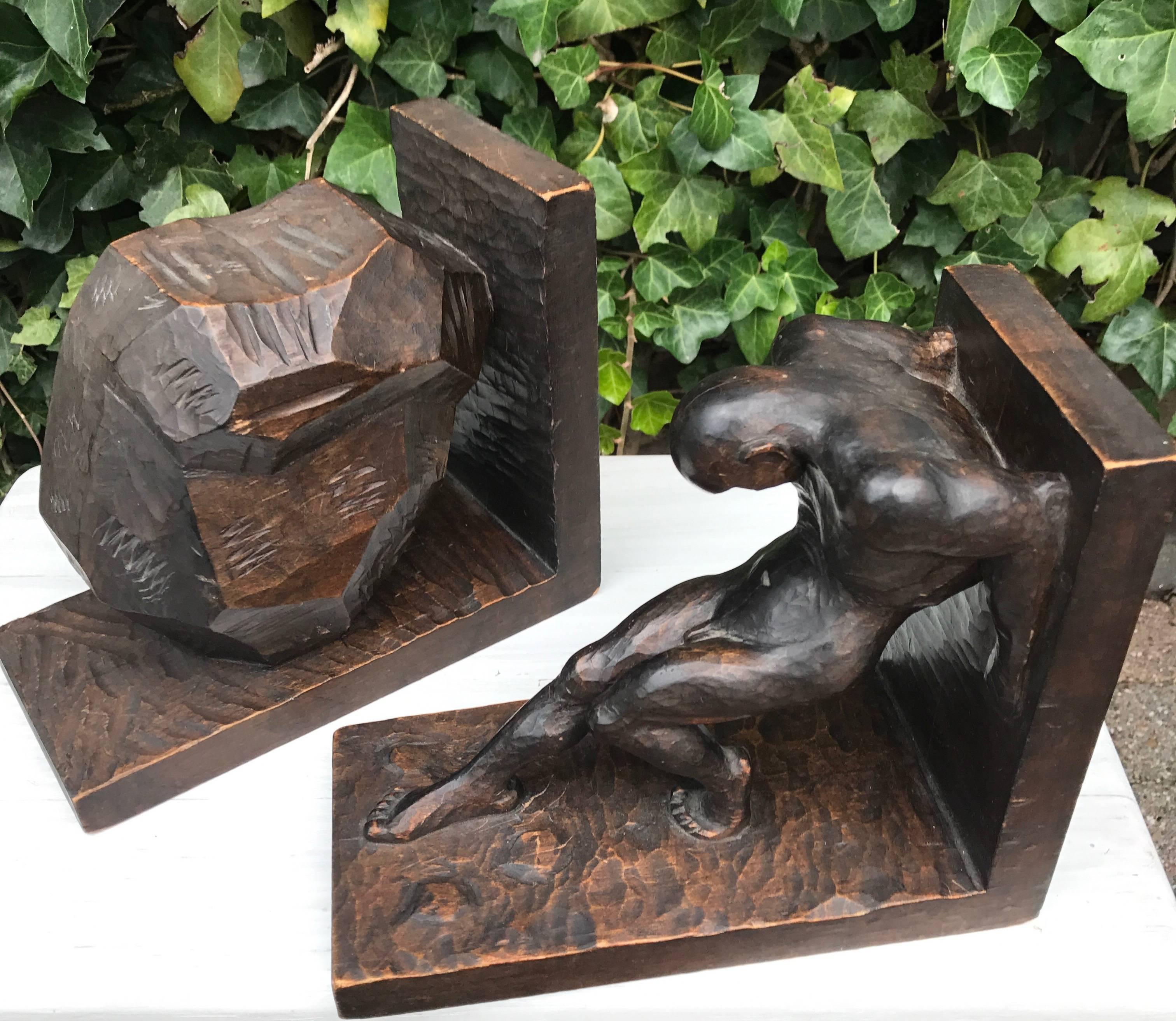 Impressive and stylized strongman bookends.

The artist who made these wonderful bookends has perfectly captured the natural posture of a man pushing his back against an object. The stylized exaggeration of the nude male's muscular body makes this