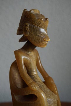 Indonesian Hand-Carved Out of Horn Wayang Dolls Sitting in Chairs Bali