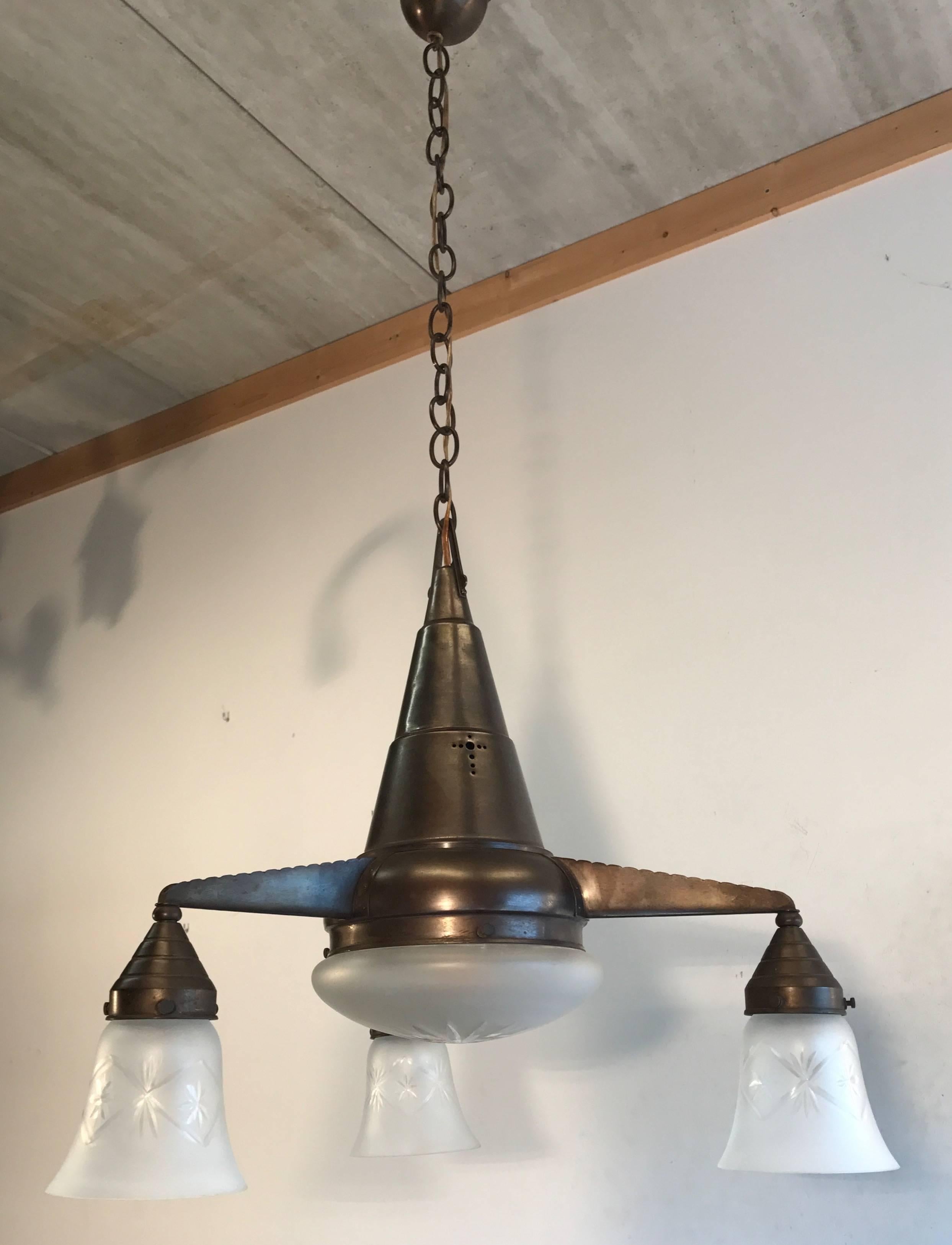 Beautiful shape, early 1900s pendant ceiling lamp.

If you have a home or an office that dates from the early 1900s or if you are a collector of stylish, Arts & Crafts home accessories than you will love the look and feel of this handcrafted, brass