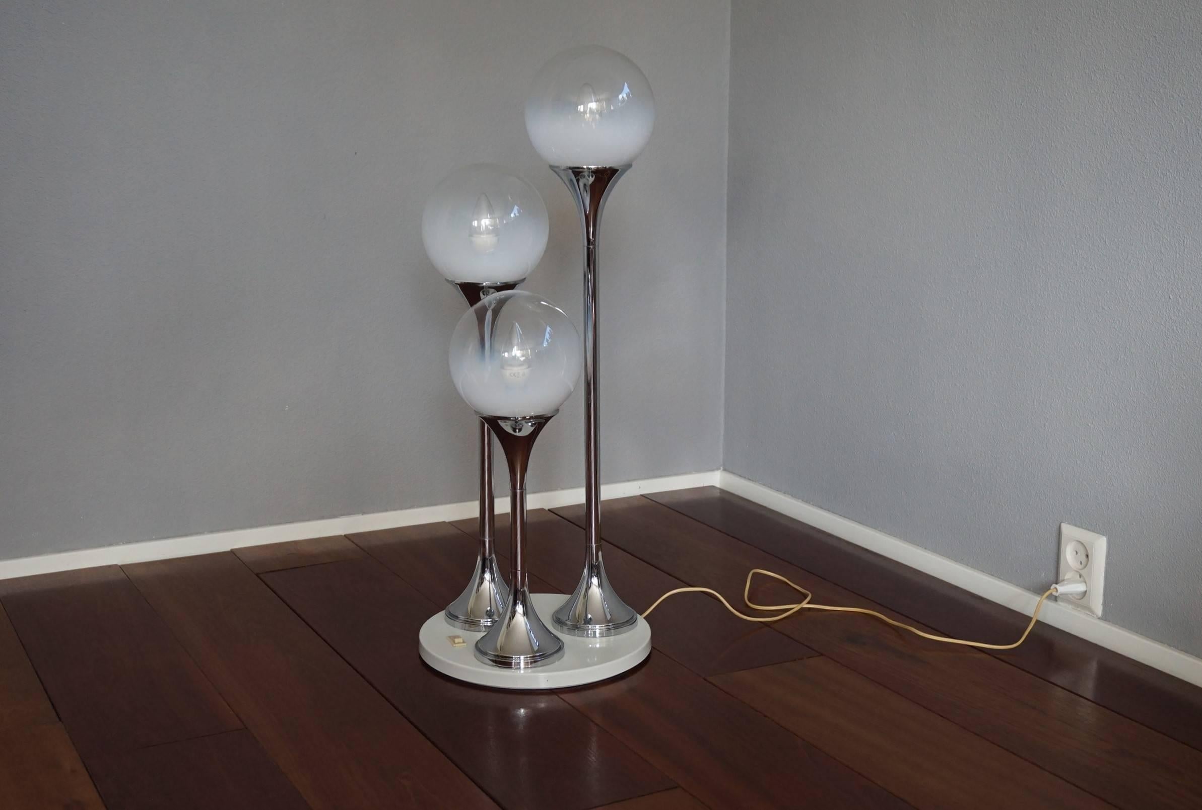 Chrome and glass midcentury lamp.

This Targetti Sankey lamp is another one of our recent finds. The combination of the white metal base, the chrome stems and the wonderful and mint, glass shades makes this lamp an absolute joy to look at, both on