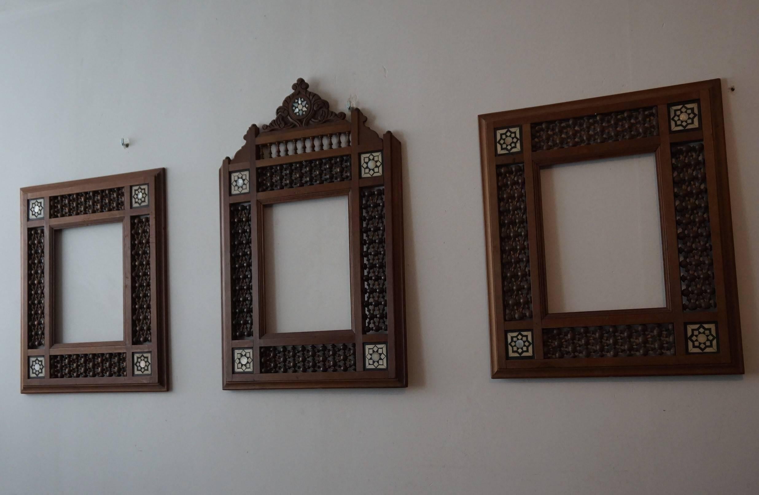 All handcrafted and very stylish set of picture, mirror or photograph frames with inlaid Islamic motifs.

If you have an Arabic (inspired) interior then this set of three Moorish picture frames will make great decoration on your wall. They would