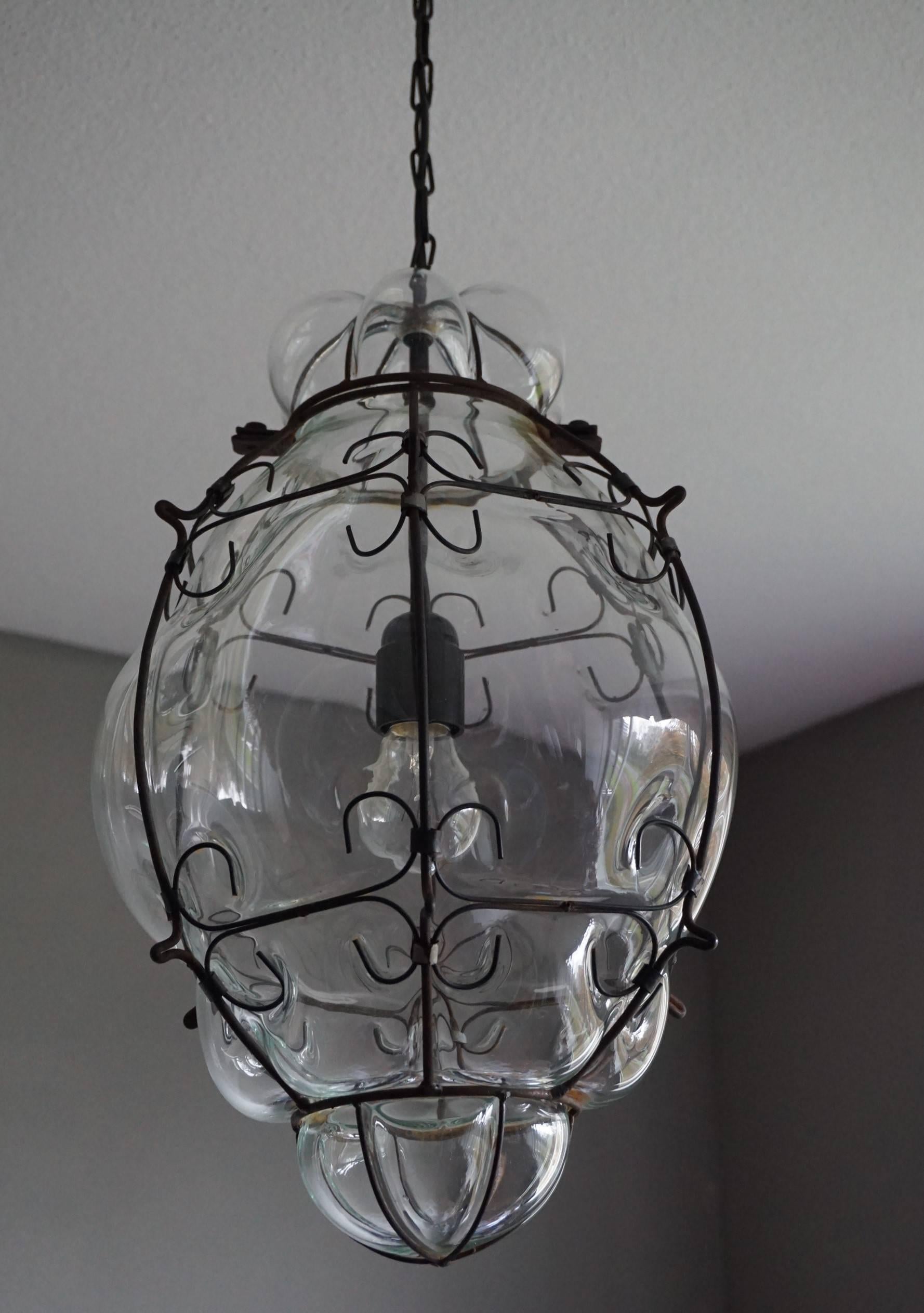 Late 20th century fine craftsmanship and excellent condition pendant.

This sizeable and stylish, single light pendant is beautiful in shape and the mouth blown, transparent glass is in excellent condition. It comes with the original black chain and