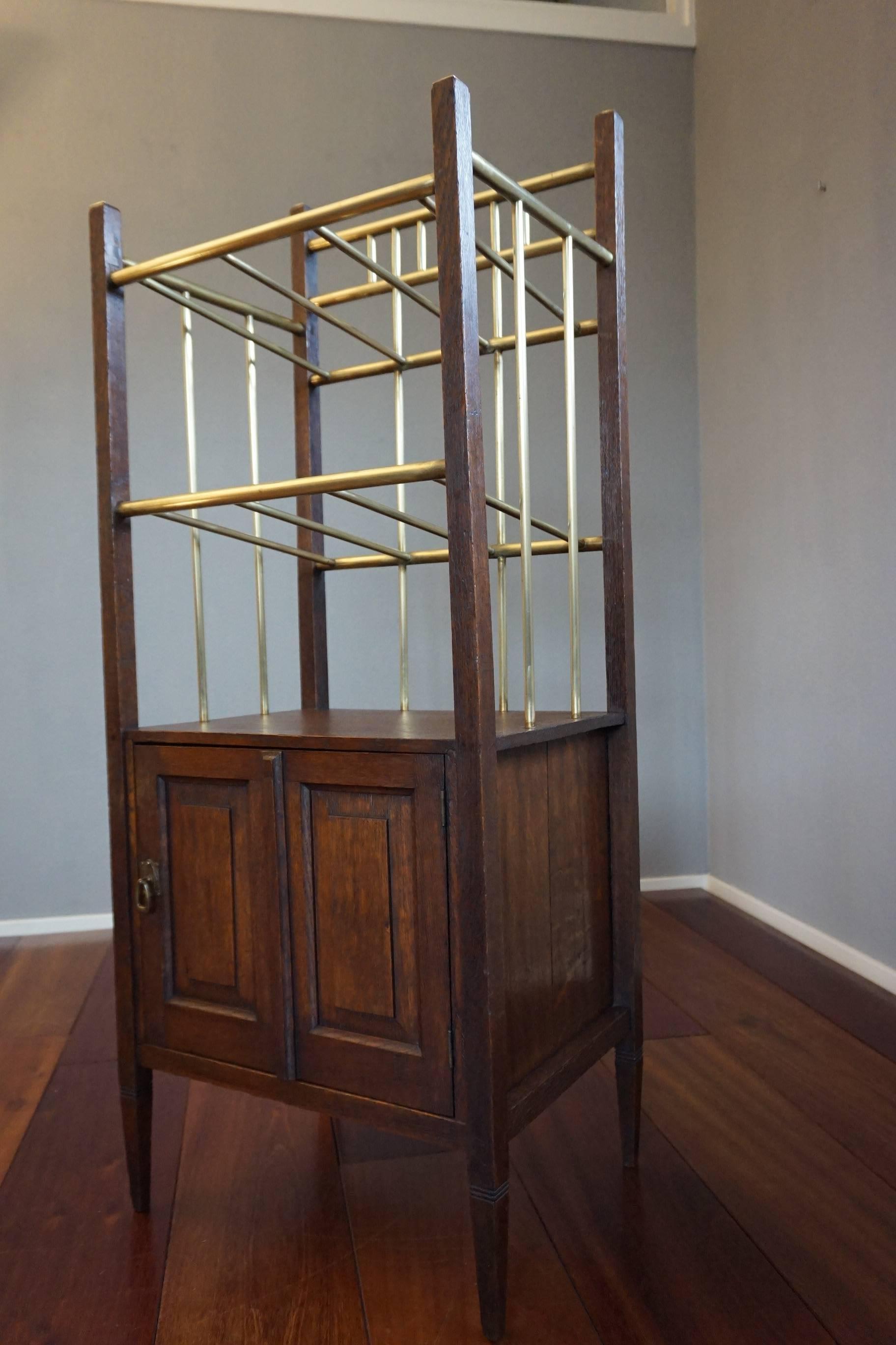 European Arts & Crafts Oak and Polished Brass Magazine Stand with Cabinet from circa 1900 For Sale
