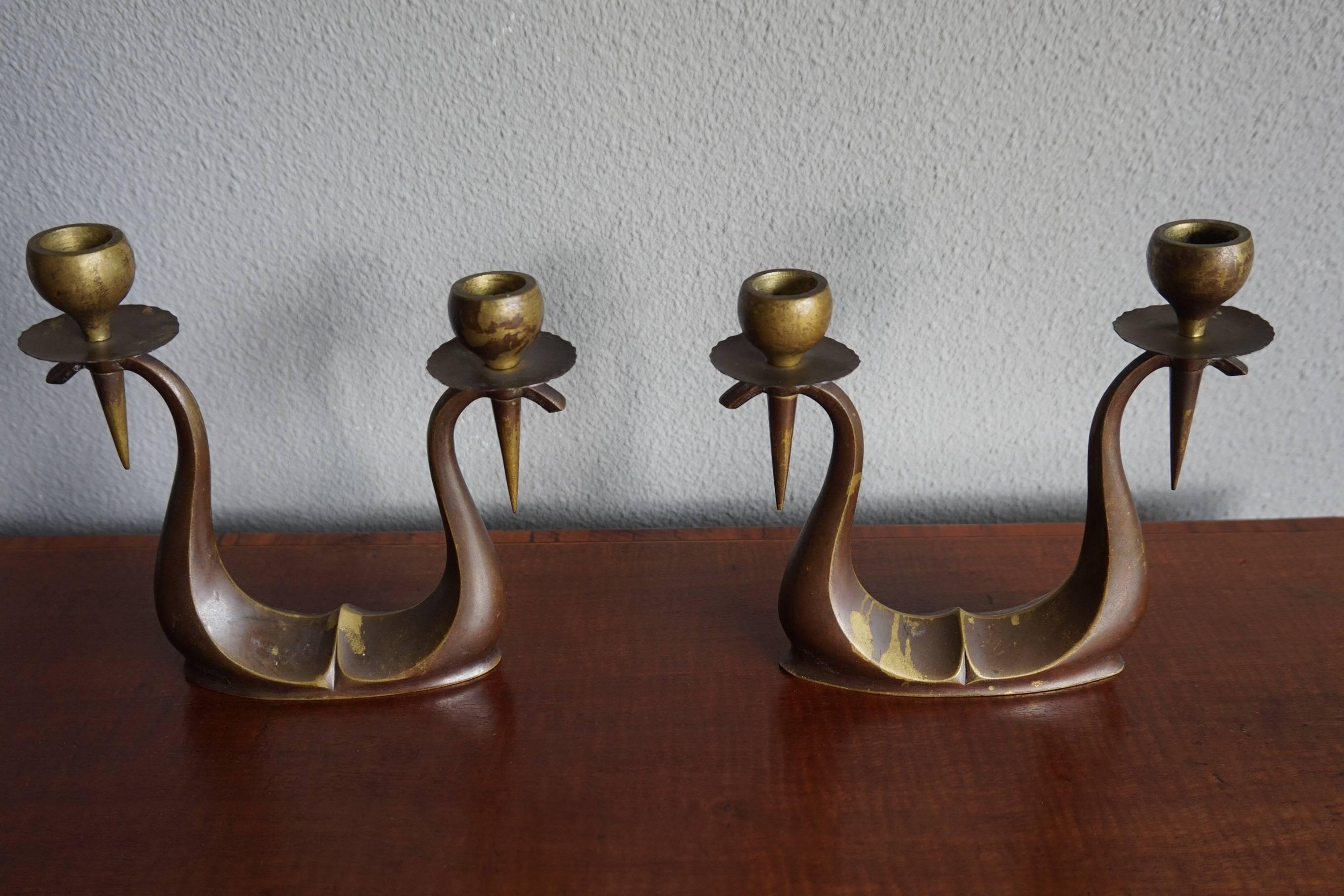 Small and aesthetically pleasing Arts & Crafts Candle holders.

The look and feel of these cast bronze, Arts & Crafts candlesticks is second to none. They are small in size and that makes them practical to put on a smaller surface. On a small side