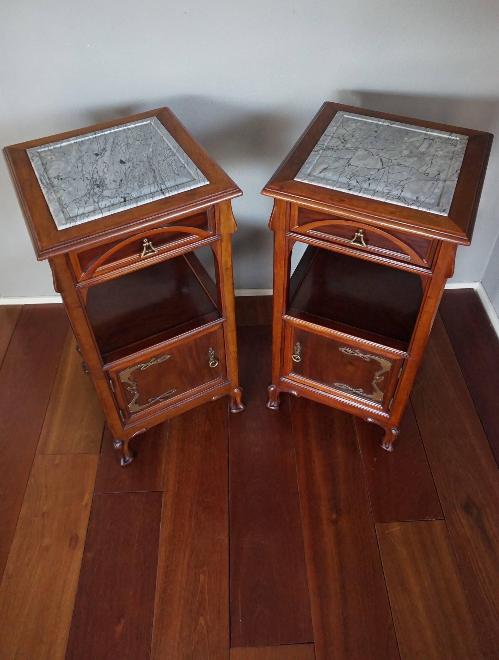 Rare and wonderful 'Ecole de Nancy' style nightstands.

This sizable and beautifully hand-crafted pair is almost entirely made of solid mahogany and the patina is breath-taking. These cabinets are not marked, but it is clear that only a top