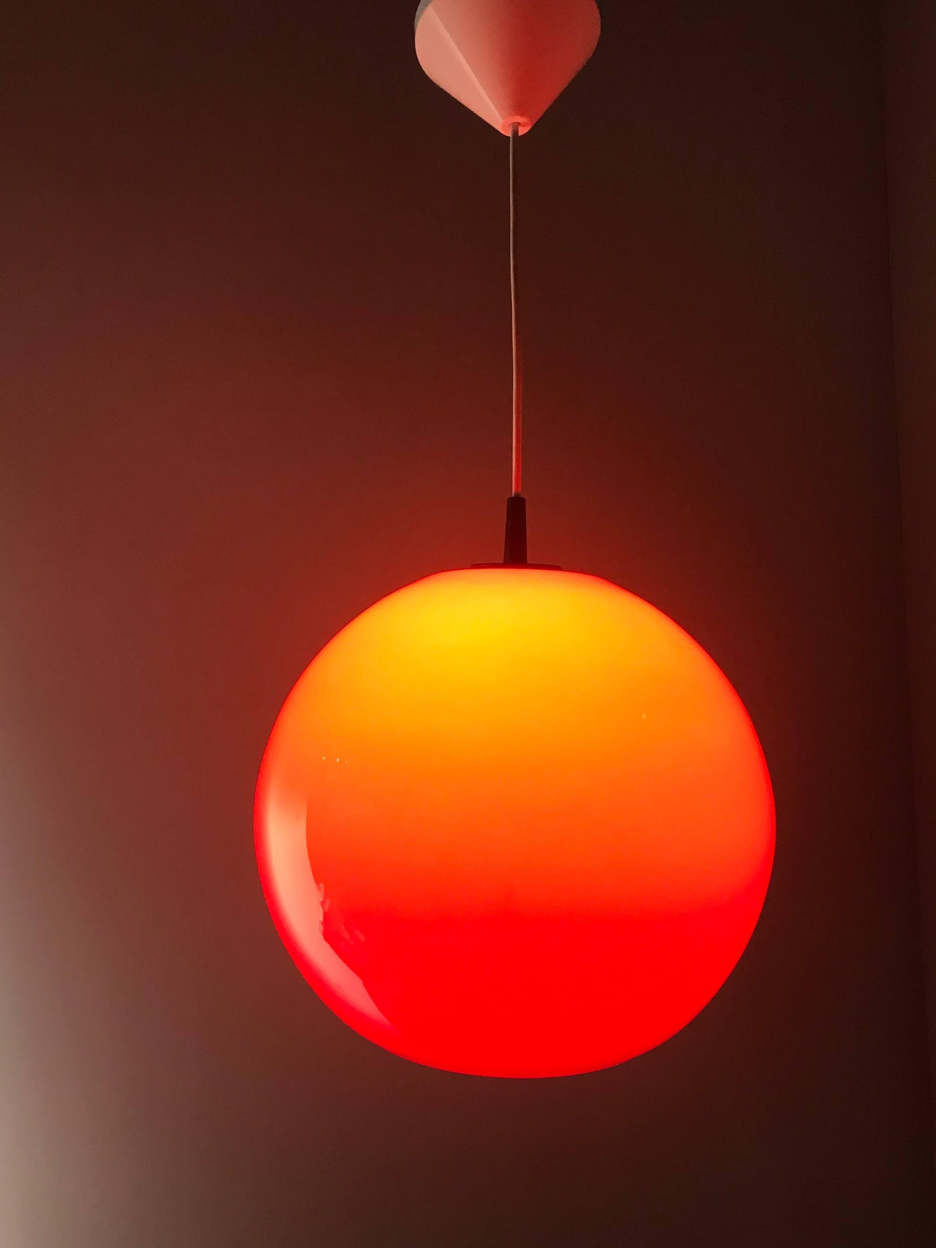 Mid-Century Modern, stunning red light fixture.

For the connoisseurs and collectors of vintage lighting we also have this beautifully designed and executed, red glass pendant. This striking red pendant is a real eye catcher and it will look perfect