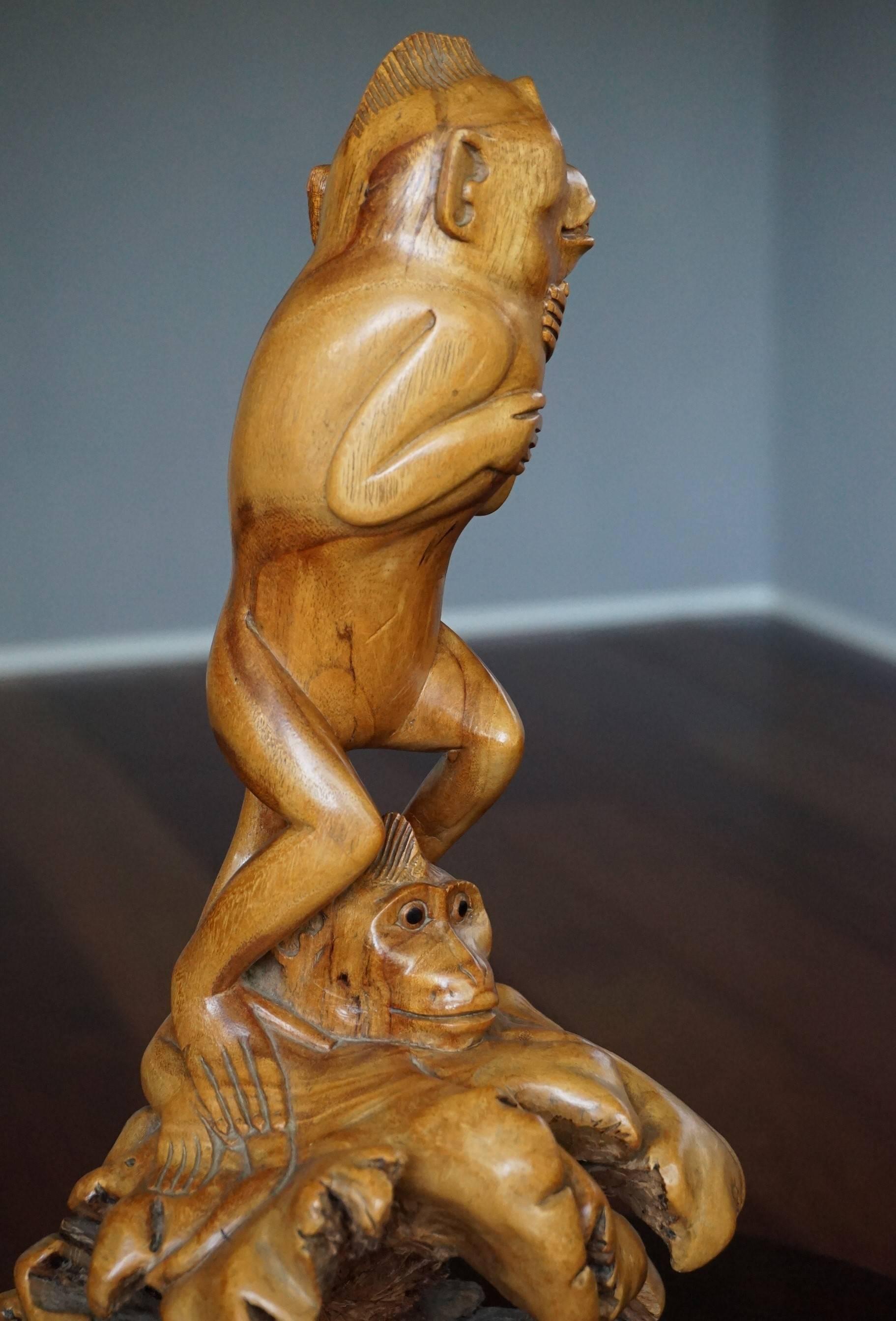 Rare and remarkable monkey sculpture.

This wonderful sculpture is entirely carved out of one piece of tropical wood. These intelligent monkeys are long-tailed macaques and this type of art is both stylish and humorous. The one standing on the